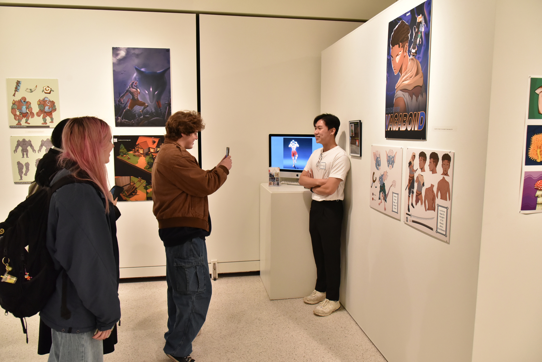 The Fall 2023 Bachelor of Fine Arts exhibition showcased work created by students earning the bachelor of fine arts degree. Continuing the high standard of Oswego art and design graduates, each student presents a selection of work as part of their degree requirement. Designed and installed by the students themselves, a variety of artistic media as well as conceptual approaches are represented in the show. Pictured, graduating senior Hoang Pham, an international student from Vietnam, presents his work.