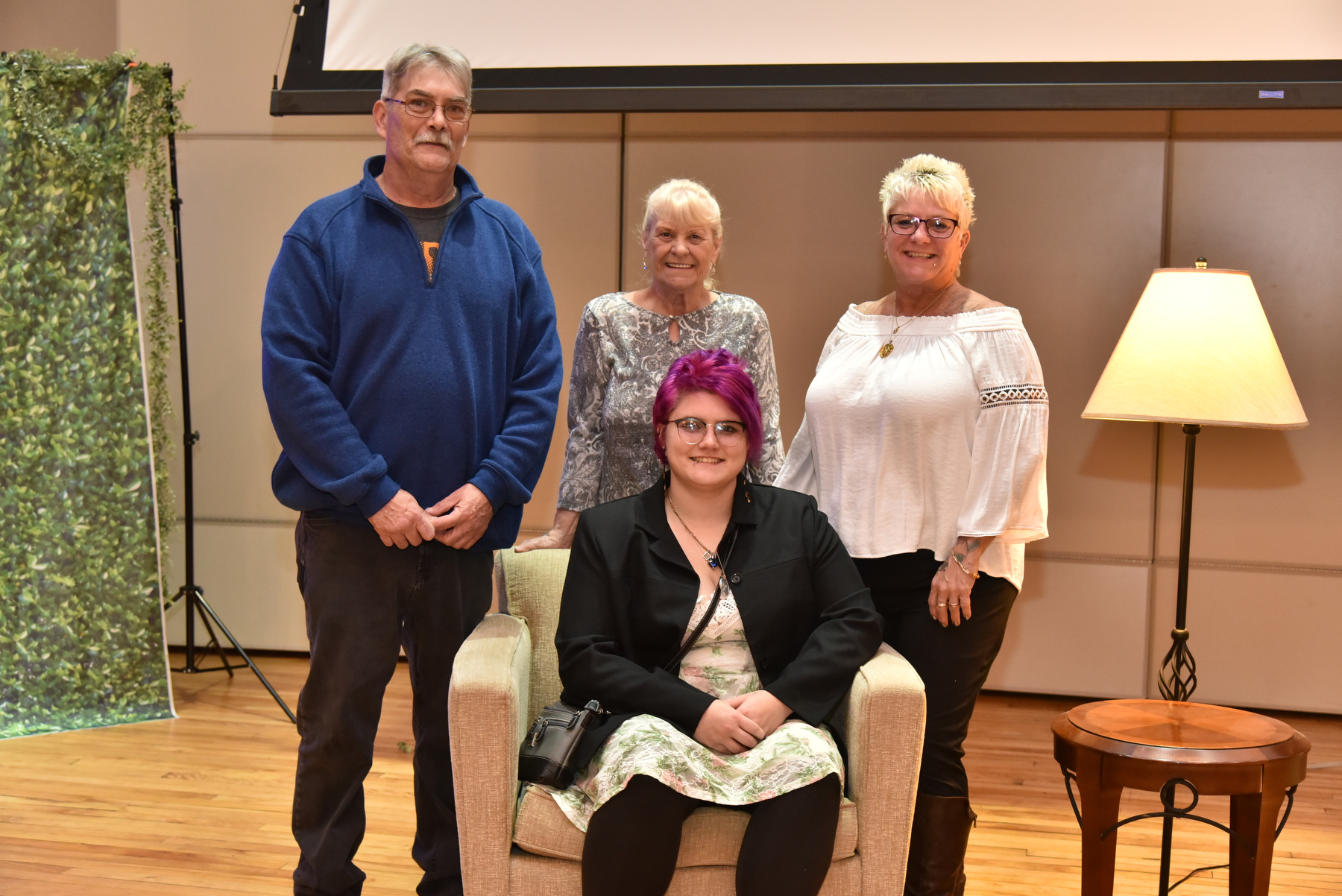 Graduate Autumn Fluty poses for a group photo with Fluty's father, mother and grandmother while attending the Commencement Eve Reception held Dec. 15 in Sheldon Hall ballroom. The event featured a celebratory toast led by Laura Pavlus Kelly ’09, executive director of the Oswego Alumni Association, to honor the December Class of 2023 where the graduates also received a commemorative Oswego alumni champagne flute.