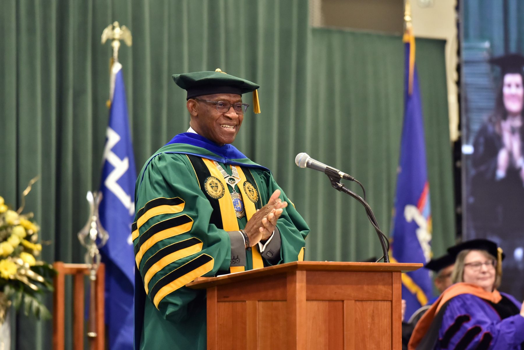 University President Peter O. Nwosu welcomes the graduates and families at the beginning of the December Commencement ceremony on Dec. 16.