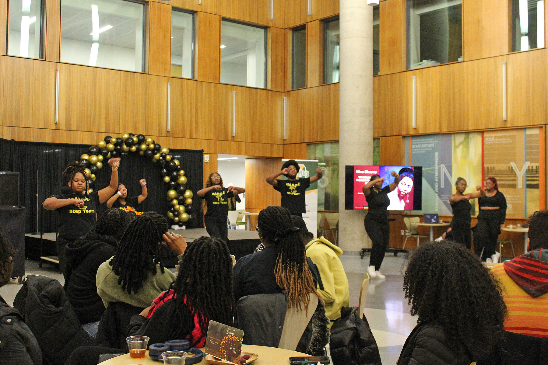 Oswego's Martin Luther King, Jr. celebration week’s new showcase event Feb. 2 included Emmy-nominated poet Jillian Hanesworth reading poetry, a student art exhibit, student poetry readings and performances, such as the student IMAGE Step Team. (Photo by Graceann Cleator) 