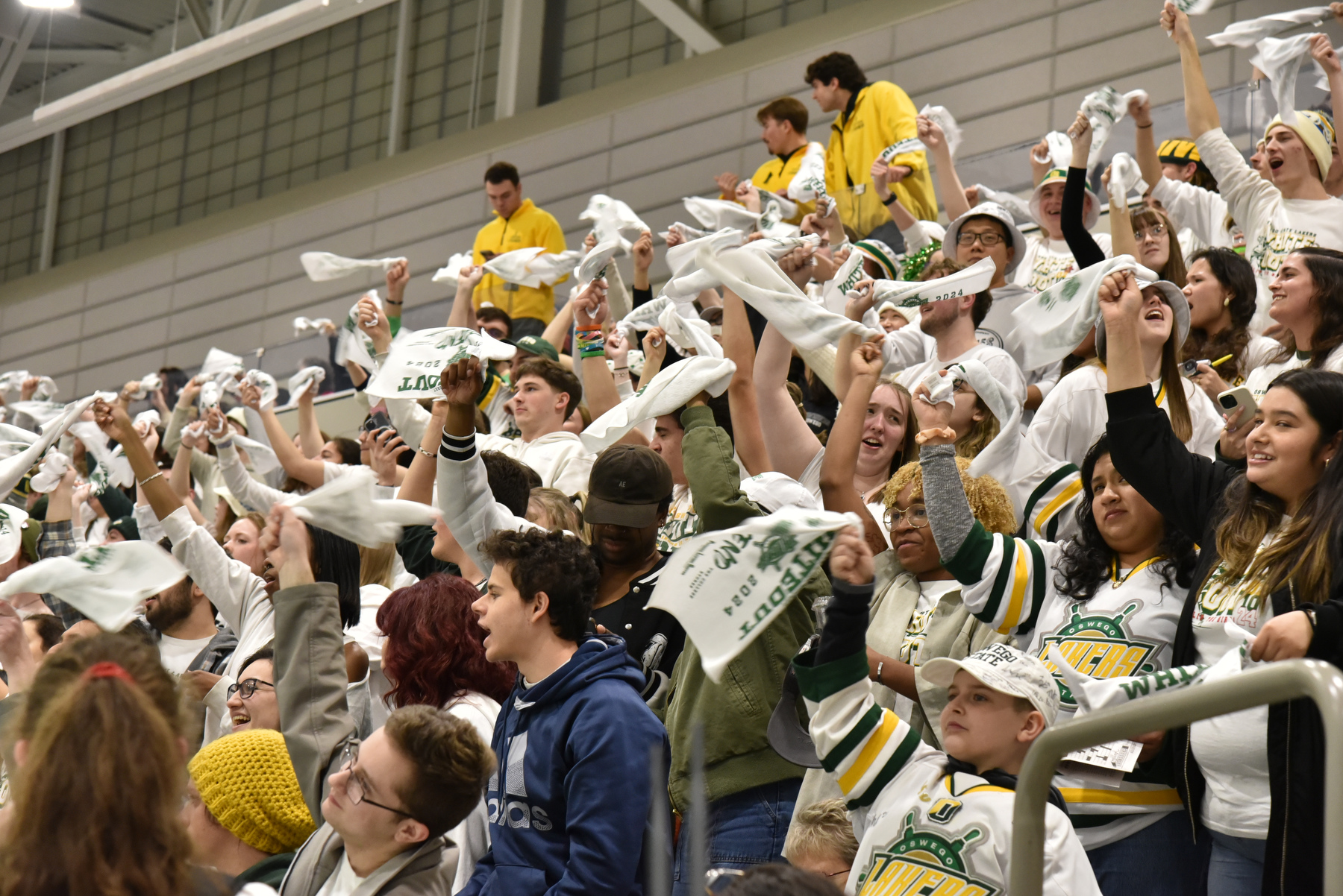 Fans cheer Oswego's second goal in the Whiteout men’s hockey rivalry game made by senior Tyler Flack en route to a 4-3 win against archrival Plattsburgh.
