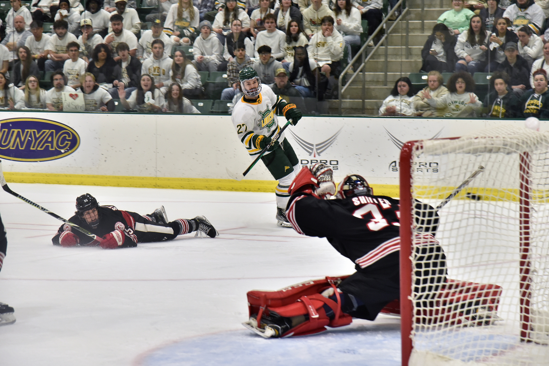 Laker senior forward AJ Ryan (#27) makes Oswego's third goal in third-period action during the annual Whiteout men's hockey contest between arch rival Plattsburgh. The Lakers won the matchup 4-3. The two teams meet again on Saturday, Feb. 24, in the Deborah F. Stanley Arena and Convocation Center in the SUNYAC semifinals.