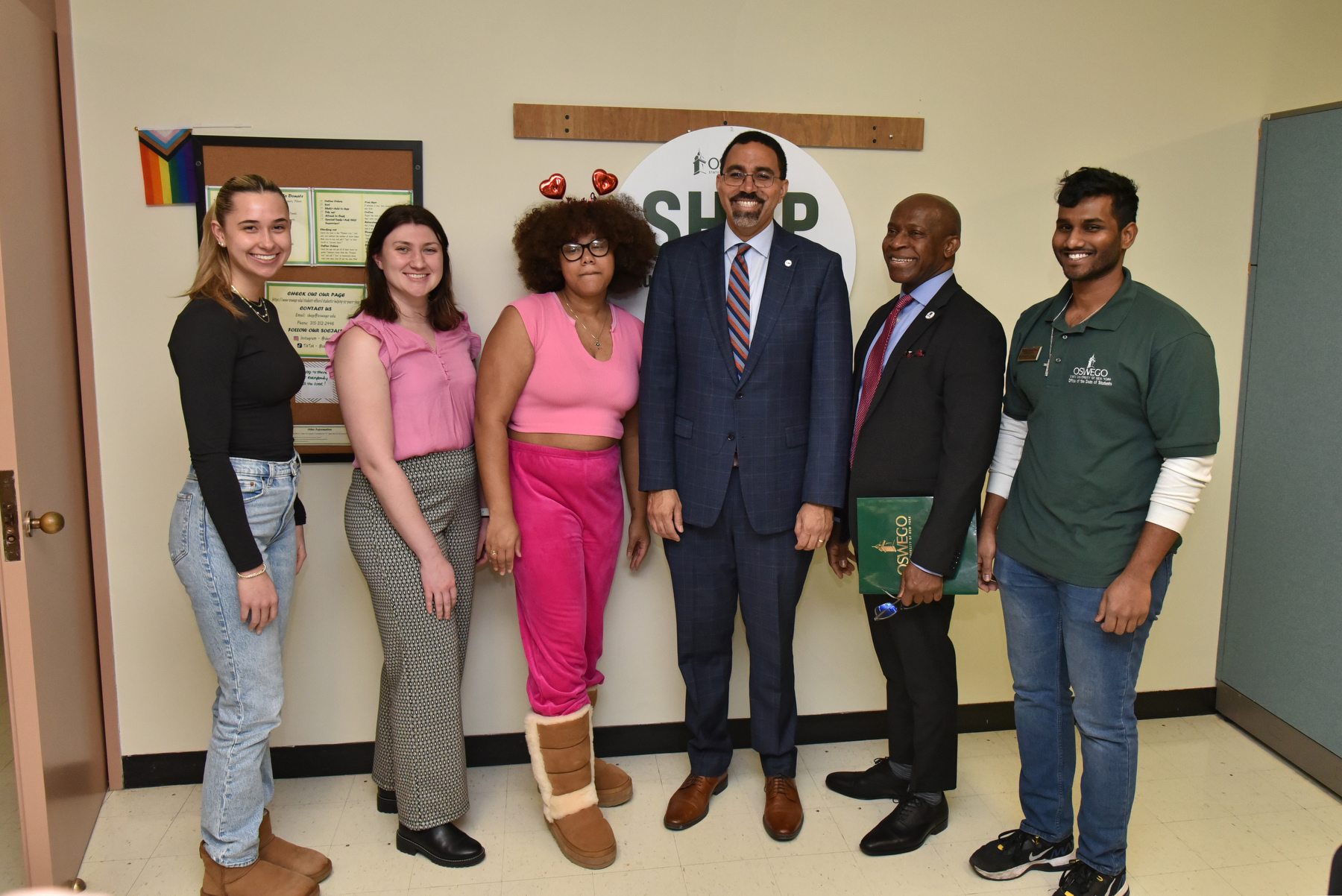 SUNY Chancellor John B. King Jr. and SUNY Oswego President Peter O. Nwosu toured the Students Helping Oz Peers (SHOP) pantry located in Penfield Library and met with student staff.