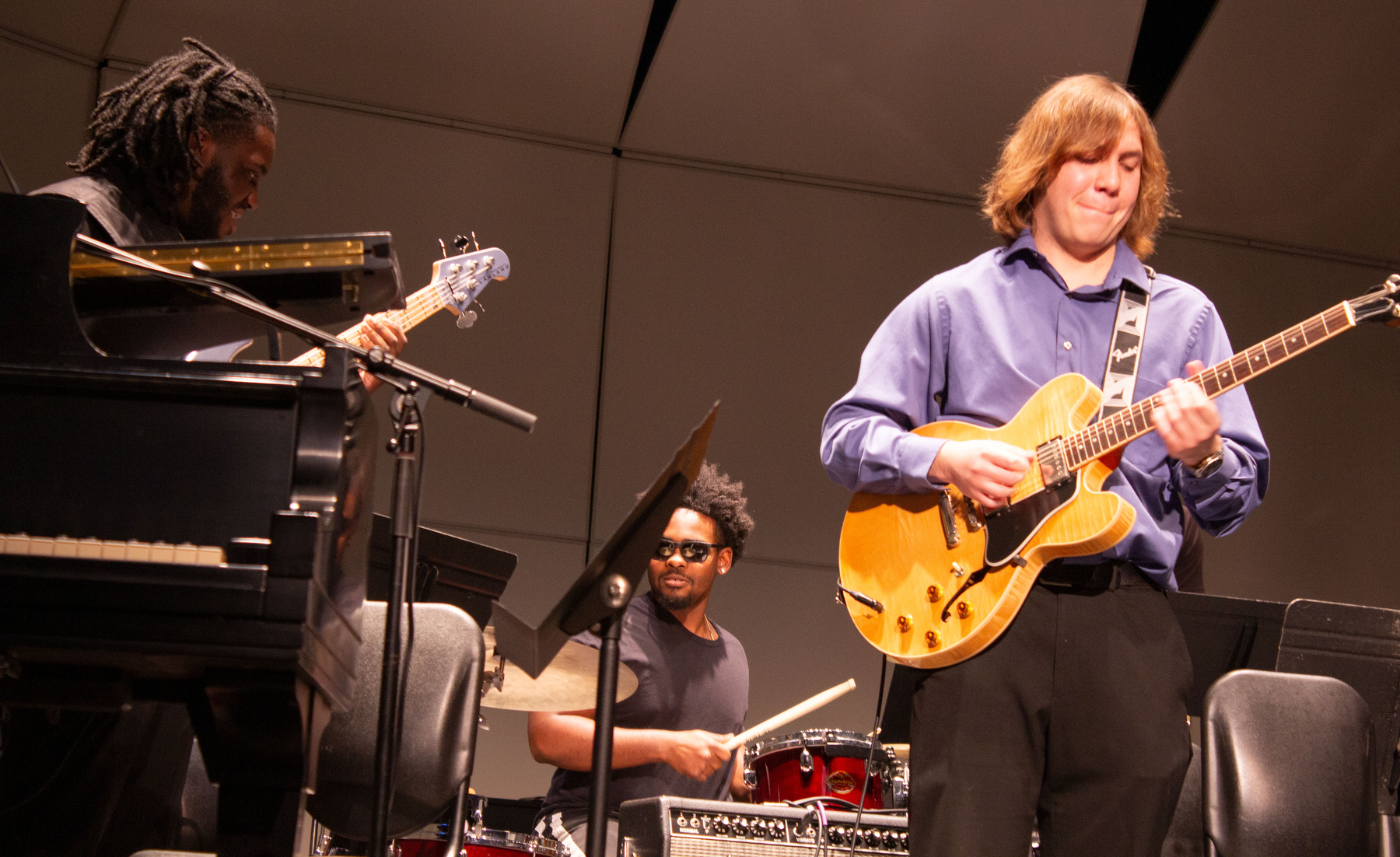 An original composition featuring student musicians during the Music Department's Collage Concert included Timothy Altbacker, vocals and rhythm guitar; Brandon Schmitt, lead guitar (left); Elijah Gebera, bass (right); Cameron Polidore, drums (center); and Angelo Antonelli, synth.
