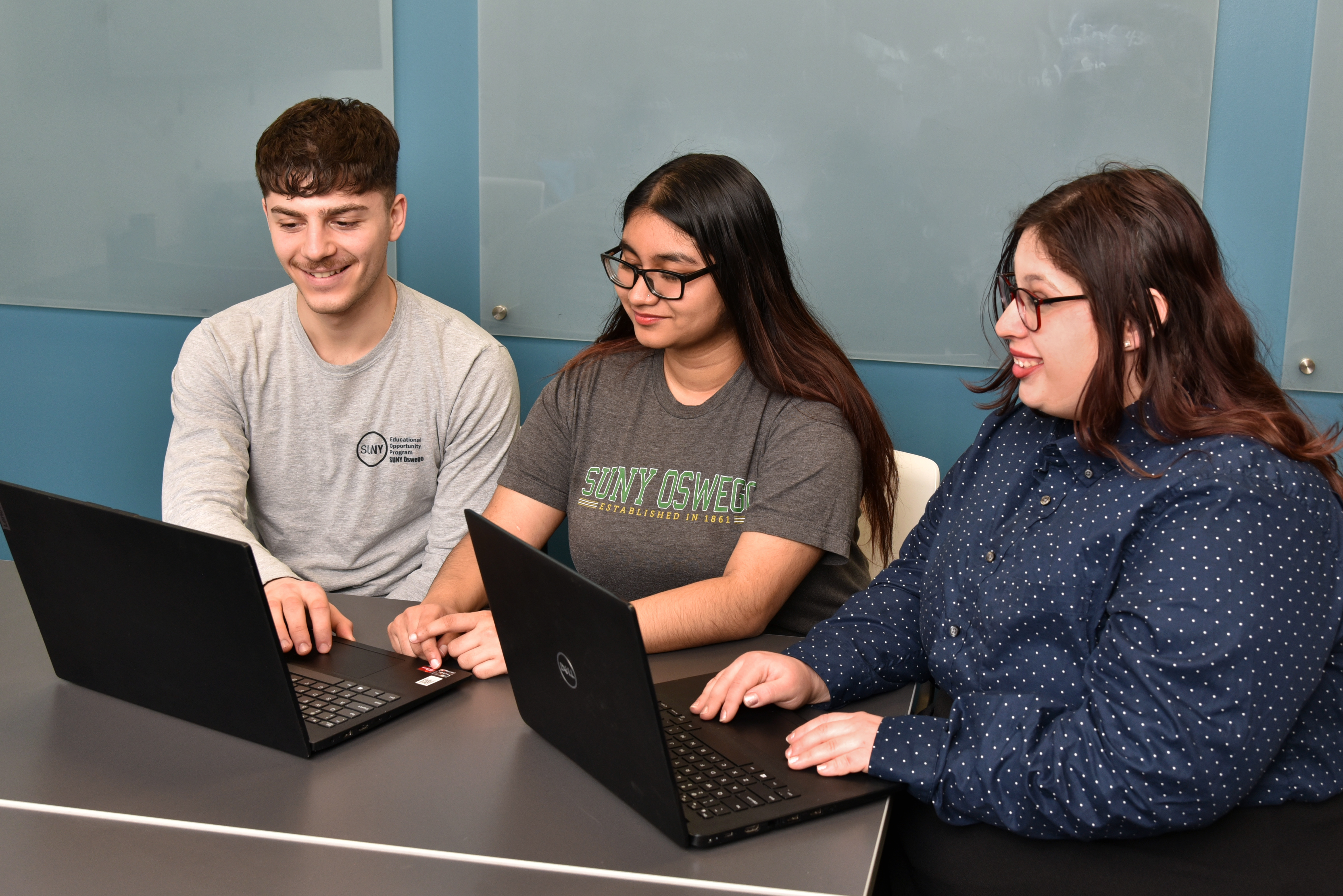 SUNY Oswego students, from left, Paul Lomanto, Norun Tabassum and Angela Aldatz, will help meet an initiative to increase FAFSA (Financial Aid Free Student Application) completion rates, thanks to support from SUNY and AmeriCorps. 
