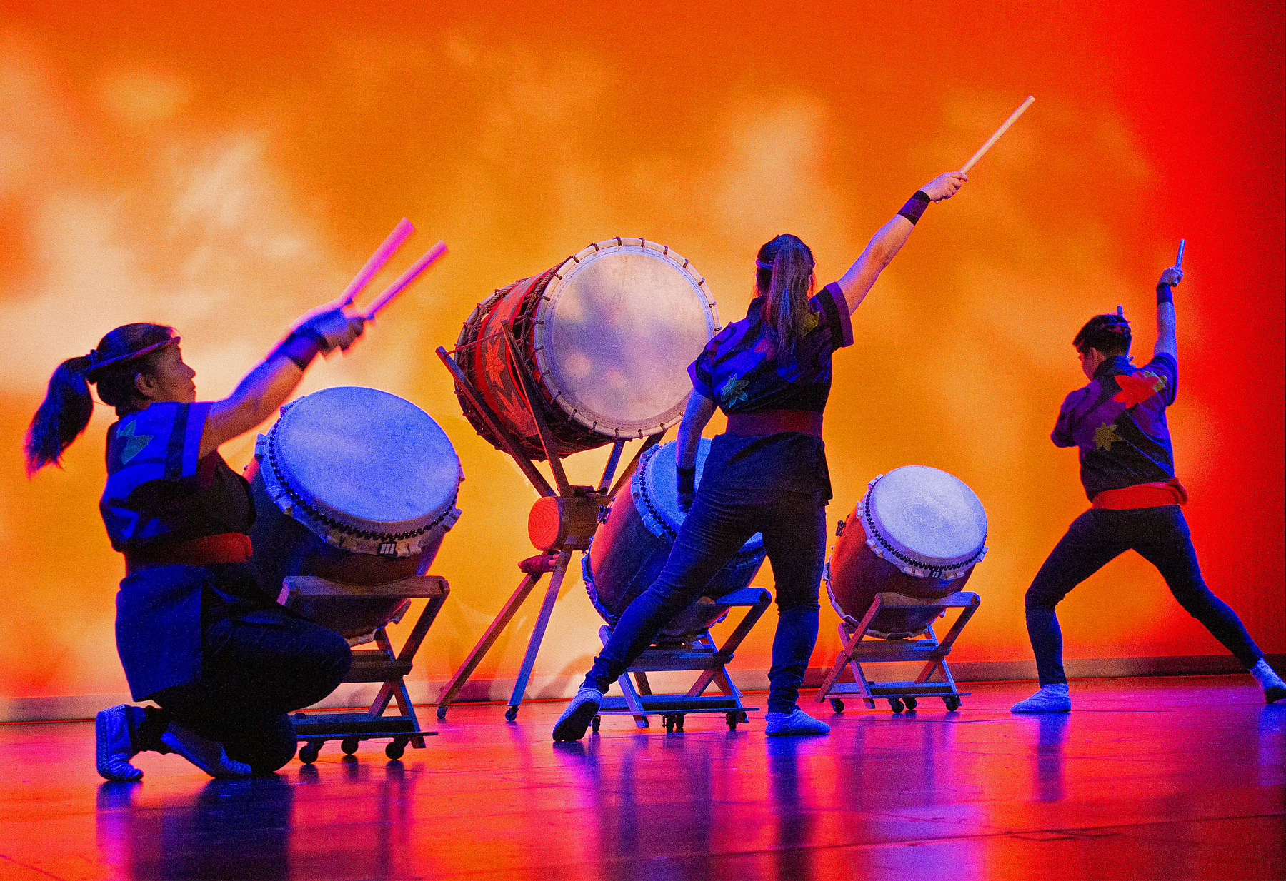 San Jose Taiko performed as part of the ARTSwego performing arts series on March 6 in Waterman Theatre. Image shows three performers with large drums.