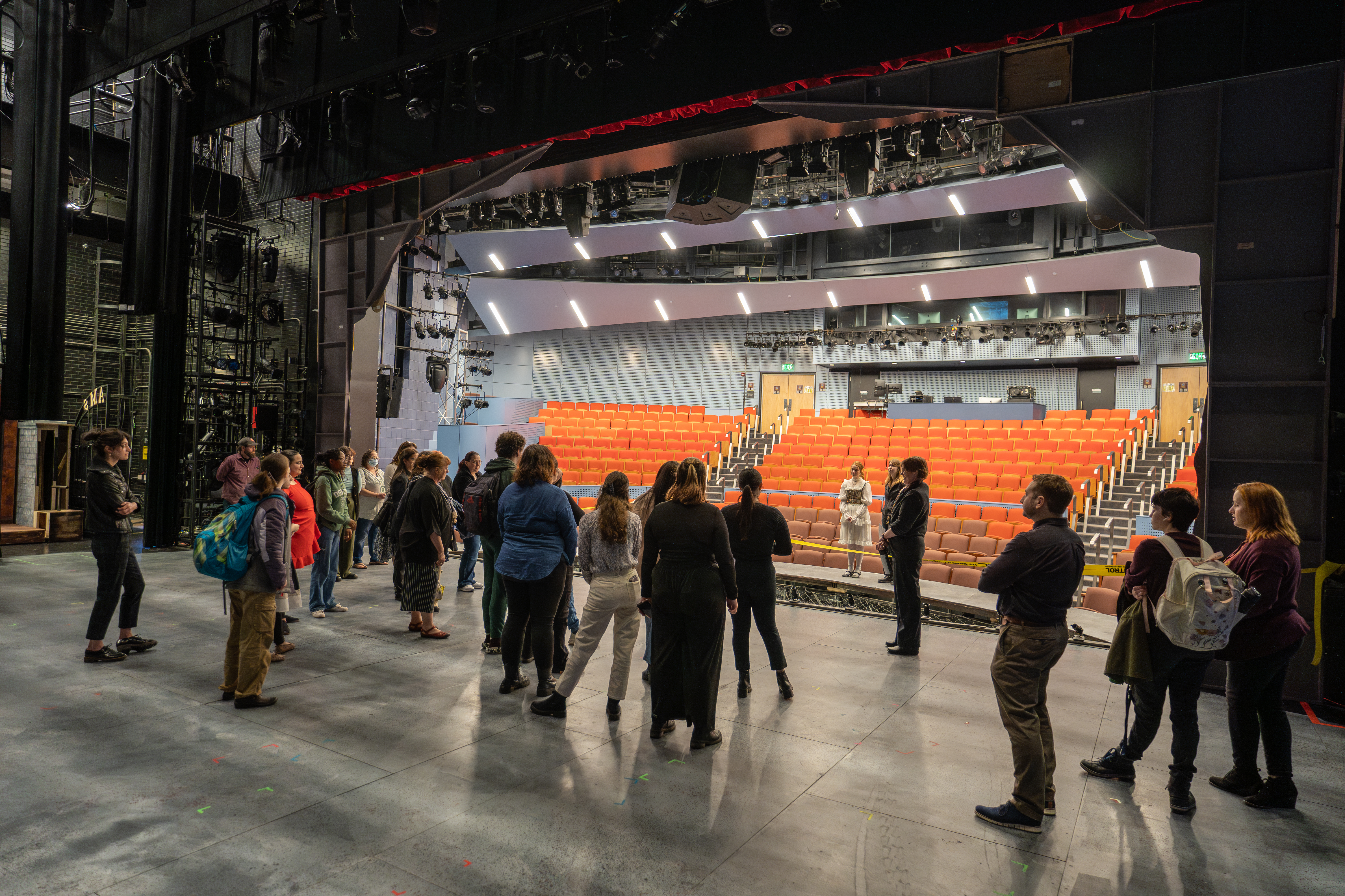 Kat McGreevy, assistant director of the recent production of “The Addams Family”, leads a segment of the backstage tour of the musical comedy production during Quest.