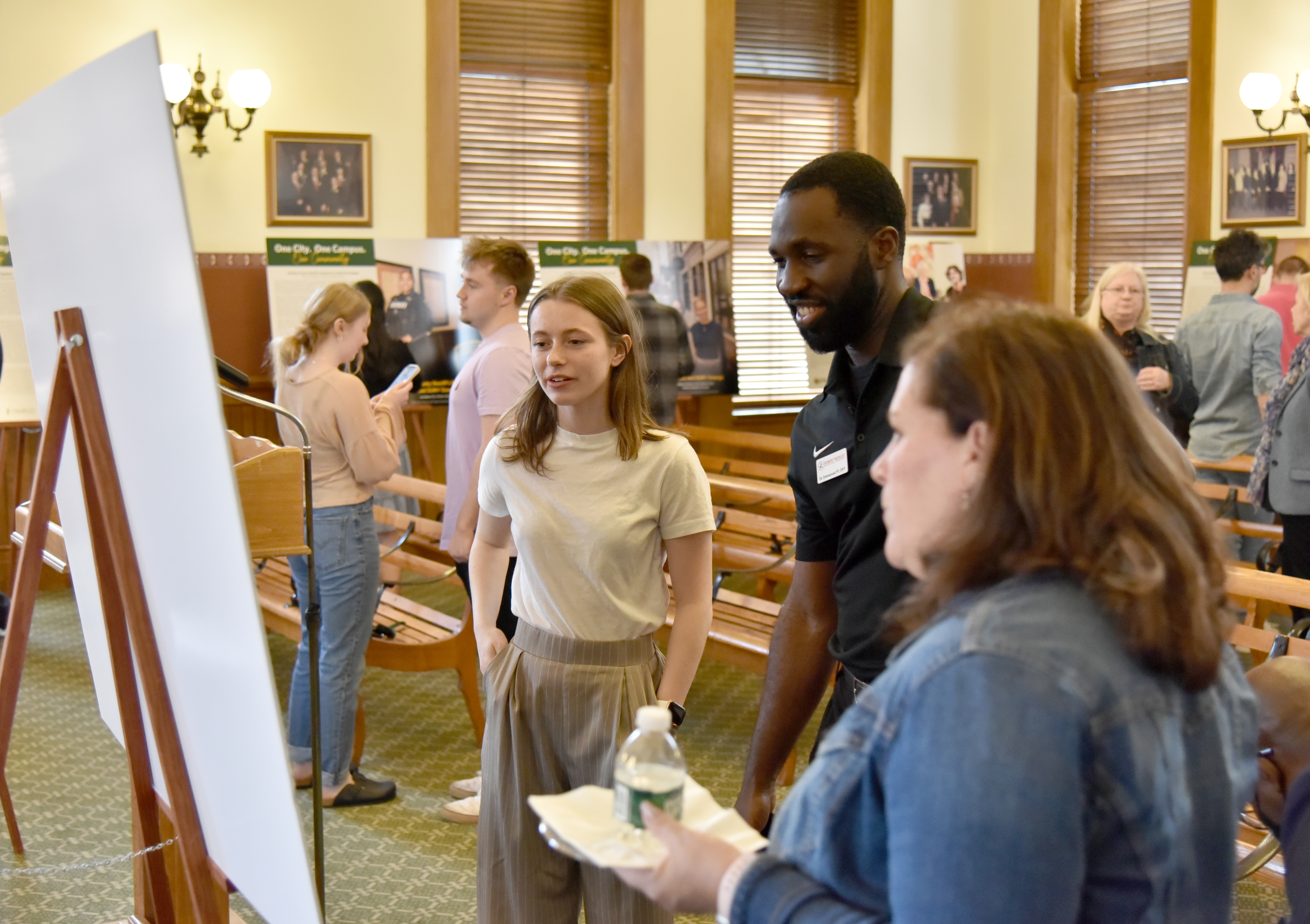 "One City. One Campus. One Community." -- a project supported by SUNY Oswego, the City of Oswego Mayor's Office and the joint Campus-City Relations Committee -- unveiled student photojournalism promoting features and connections around the community on May 1 in Oswego's City Hall.