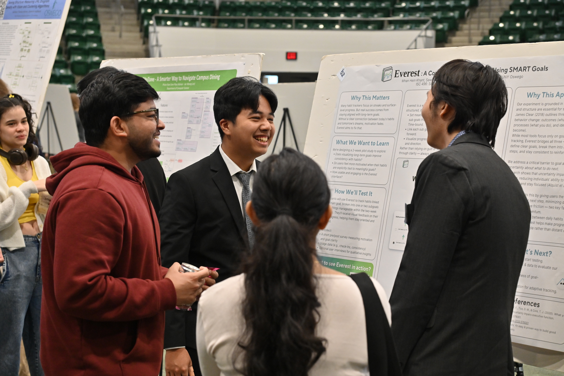 Students explain their research work in the popular poster session during Quest. computer science students Mhan Hein Khant and Saw Hosanna present their work "Everest: A Contextual Habit Tracker Using SMART Goals."