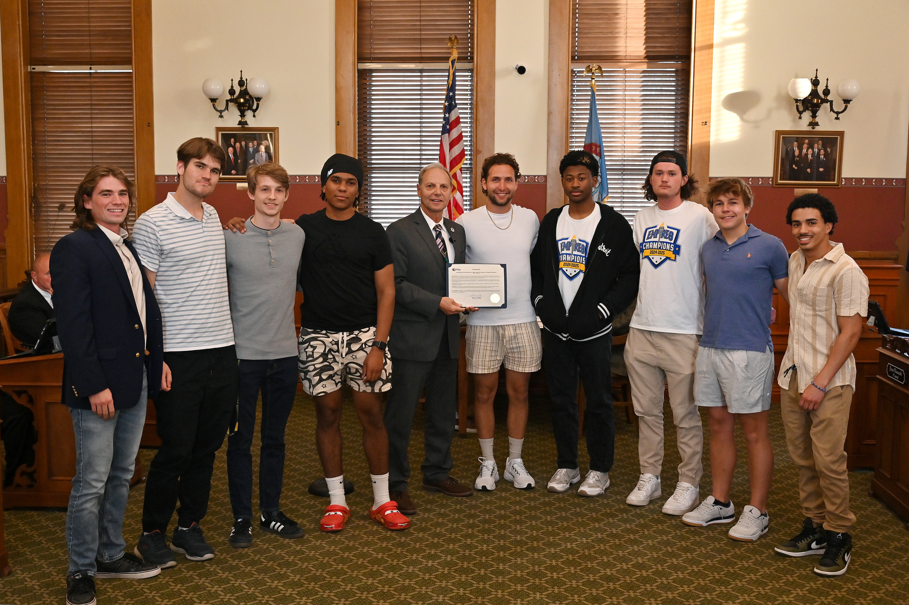 The City of Oswego honored two Laker teams on May 12 for winning their SUNYAC tournaments. Here the men’s tennis team receives a proclamation and congratulations from Mayor Robert Corradino.