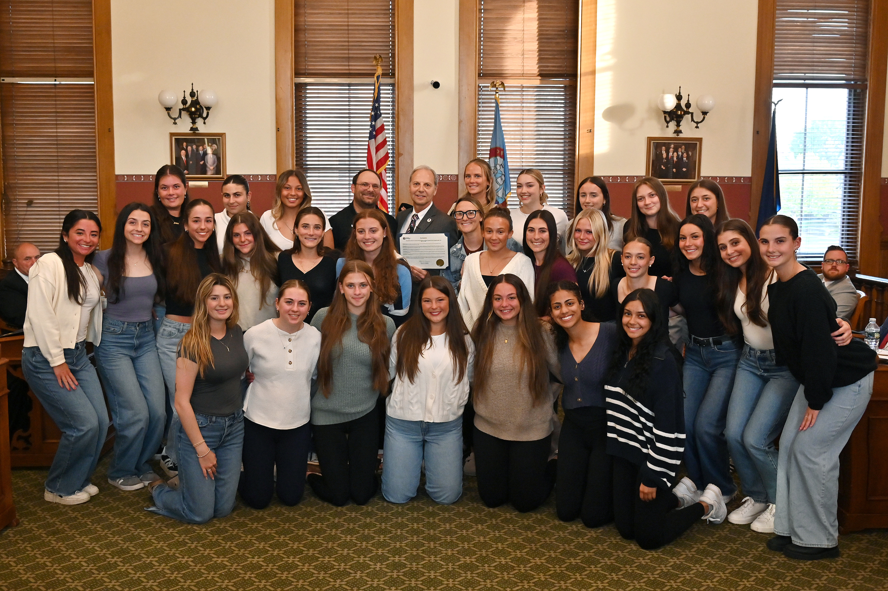 The City of Oswego honored two Laker teams on May 12 for winning their SUNYAC tournaments. Here the women's lacrosse team receives a proclamation and congratulations from Mayor Robert Corradino.