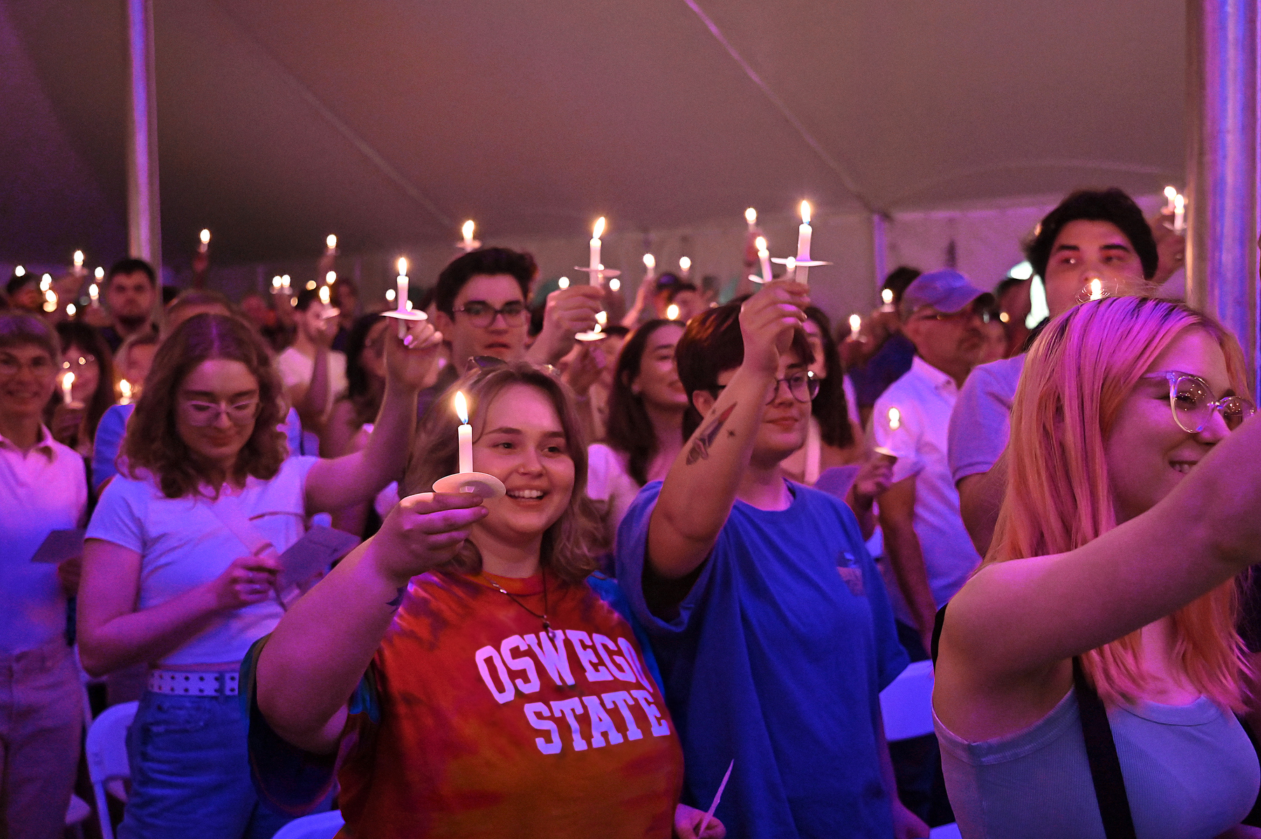 Graduating seniors, families and friends pass the flame of learning during the Commencement Eve Torchlight Ceremony on May 16.