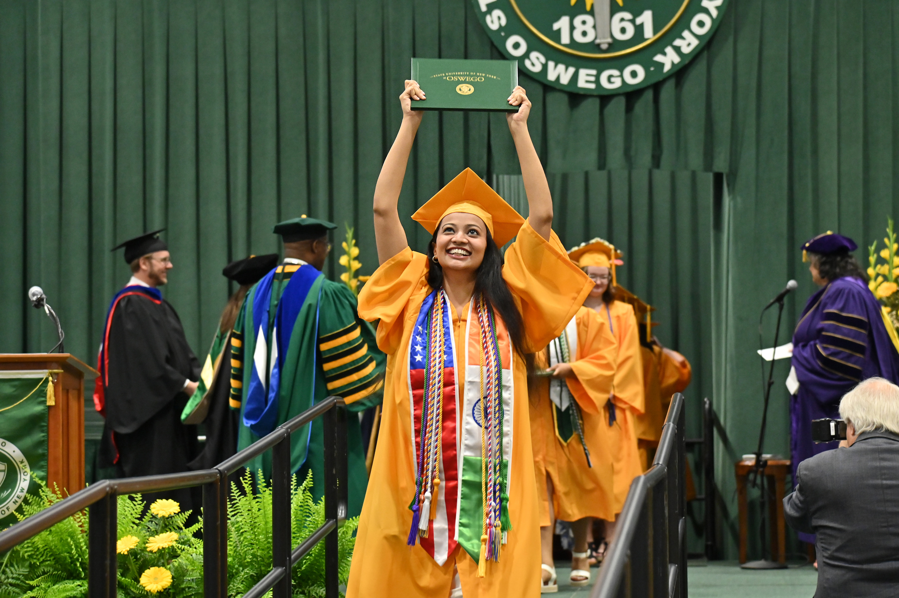Enthusiastic graduates at the 9 a.m. College of Liberal Arts and Sciences ceremony and subsequent graduations on May 17 celebrated their accomplishments.