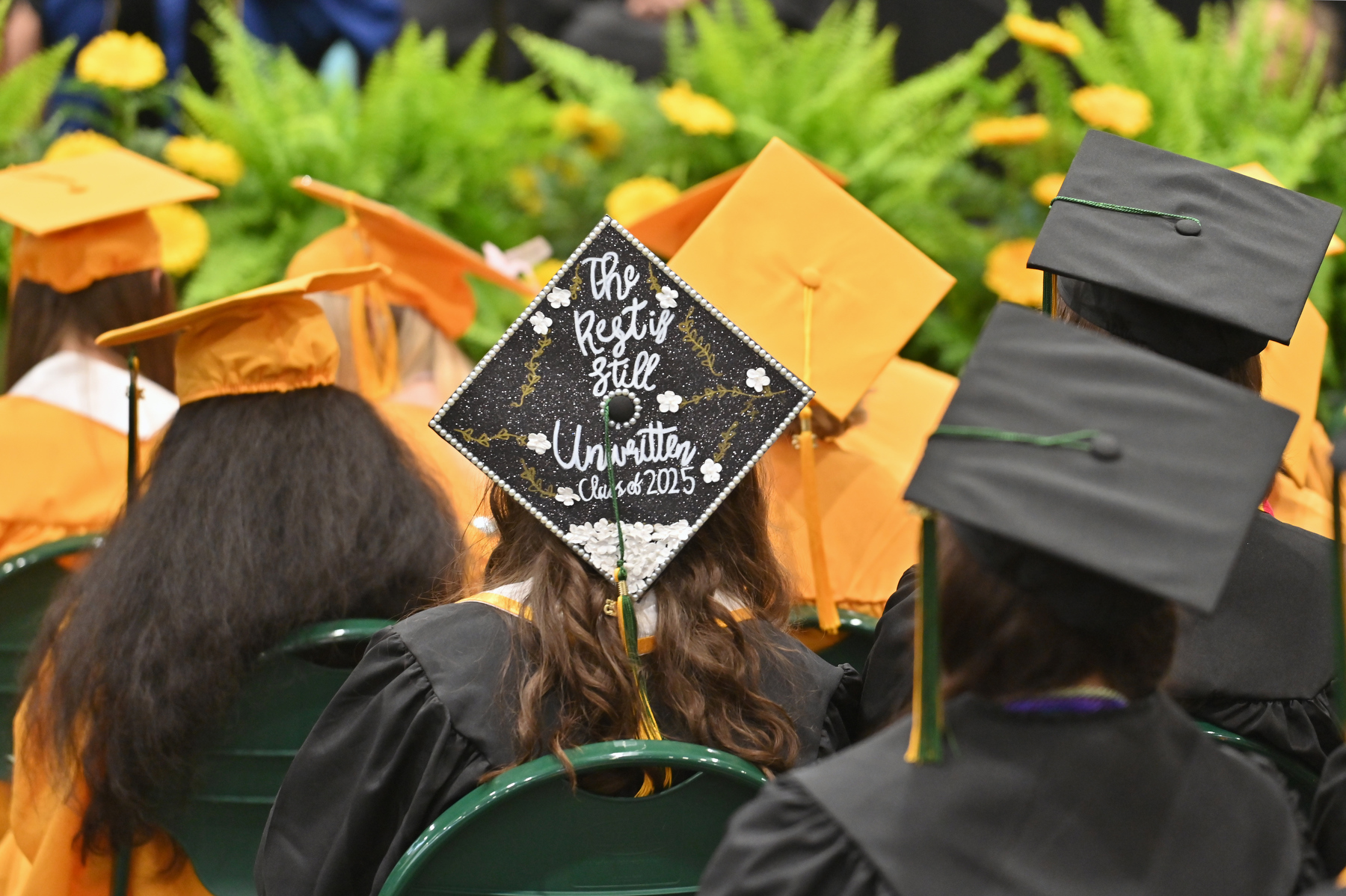 Messages of accomplishments, optimism and gratitude decorated caps during May 17 Commencement ceremonies, including this one noting "The Rest is Still Unwritten, Class 2025."
