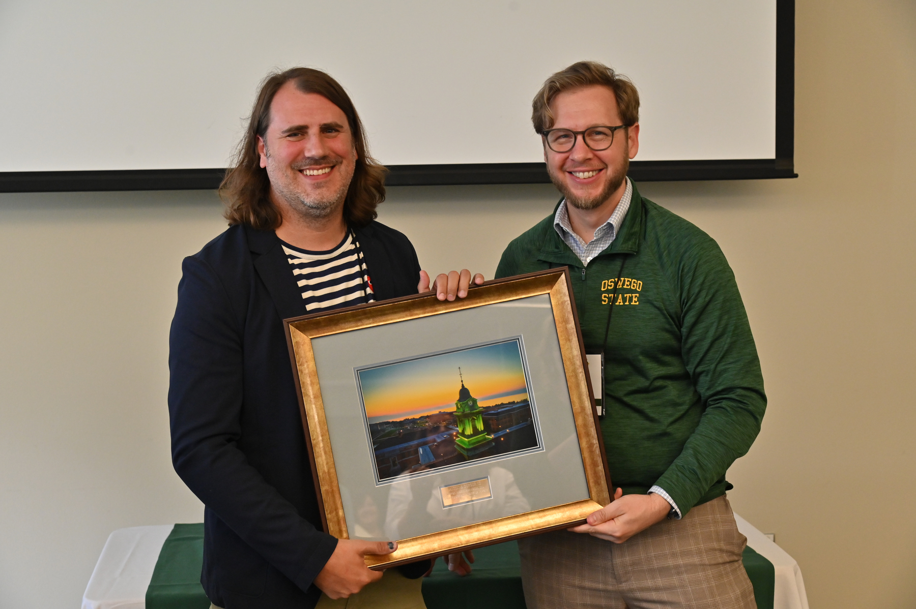 Antoine Dufour, a 2005 graduate who is now a researcher at University of Calgary’s Cumming School of Medicine, earned the Distinguished Alumnus Award at the University Update program during Alumni Reunion Weekend. Presenting his award is Heath Wood, vice president for university advancement.