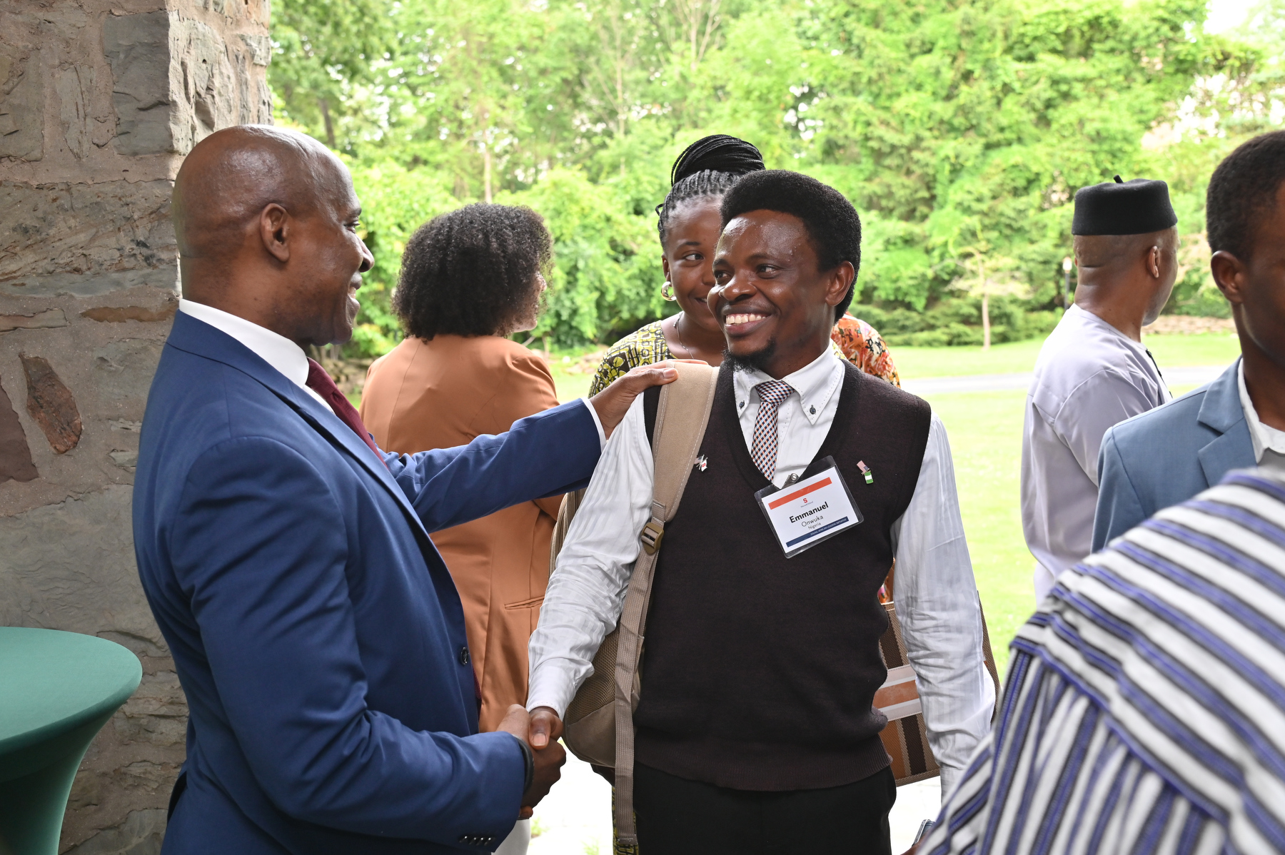 President Peter O. Nwosu welcomes students and faculty to Shady Shore for the Mandela Washington Fellowship Presidential Reception on July 7. Pictured is Emmanuel Onwuka, a Nigerian student at Syracuse University’s Maxwell School of Citizenship and Public Affairs.