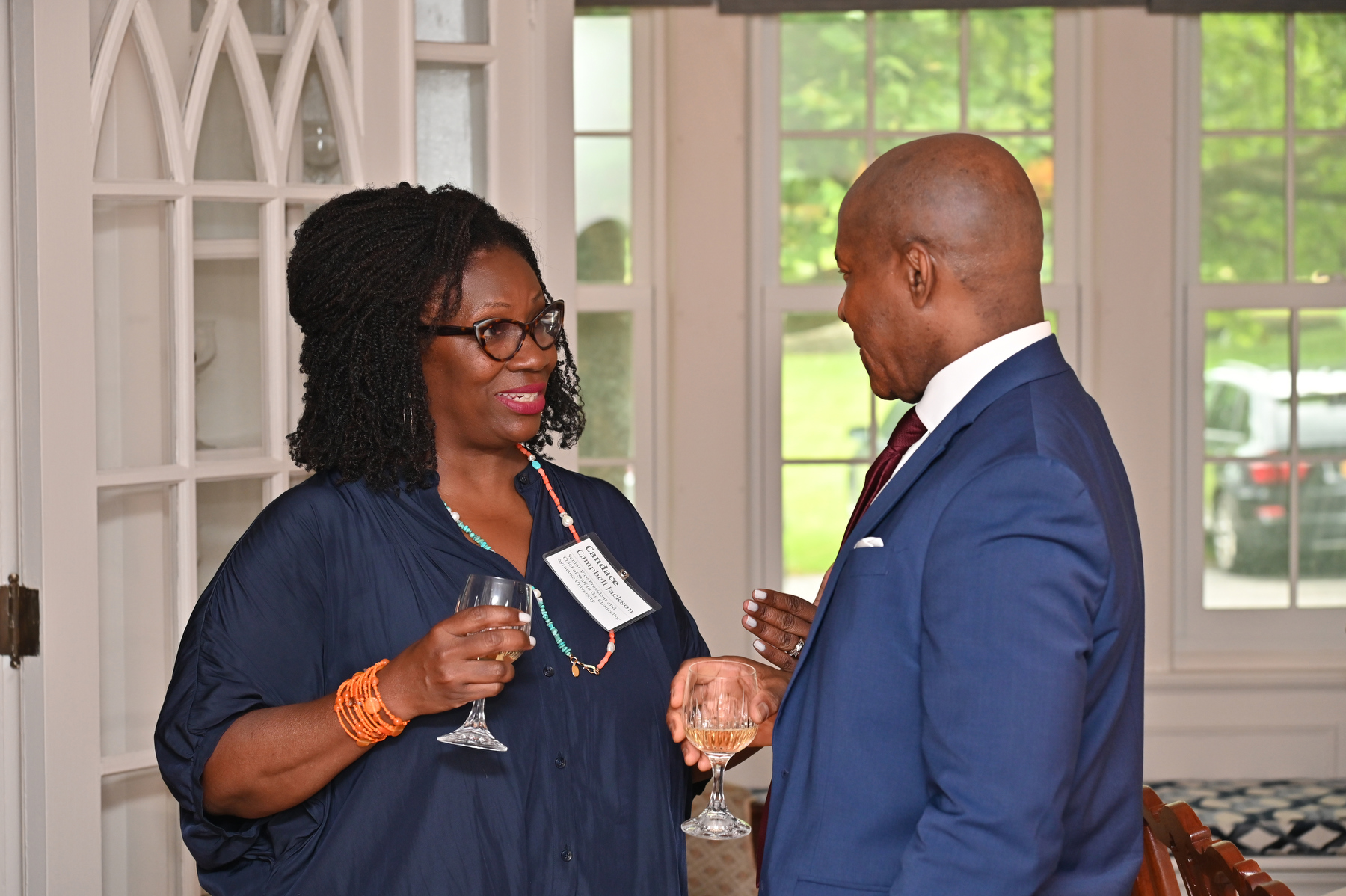 President Peter O. Nwosu talks with Candace Campbell Jackson, senior vice president and chief of staff to the chancellor at Syracuse University, during a July 7 reception welcoming participants in the Mandela Washington Fellowship program.