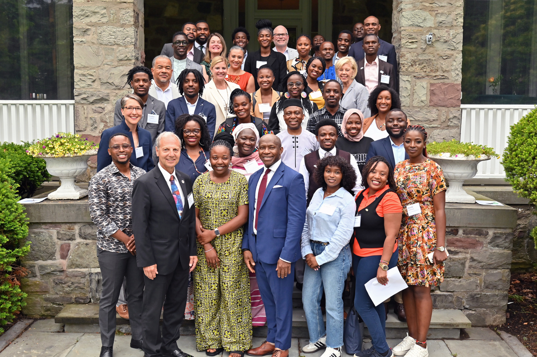 The Mandela Washington Fellowship for Young African Leaders visited campus for a reception on July 7. President Peter O. Nwosu welcomed the fellows, as well as Oswego students, faculty and staff, and City of Oswego Mayor Robert Corradino. Here participants pause for a commemorative photo on the steps at Shady Shore.