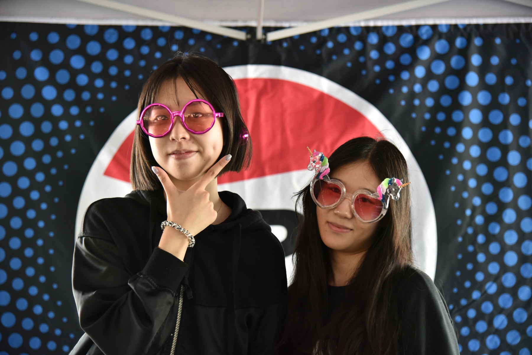 Students have some fun at the photo booth during the opening picnic held Aug. 21.