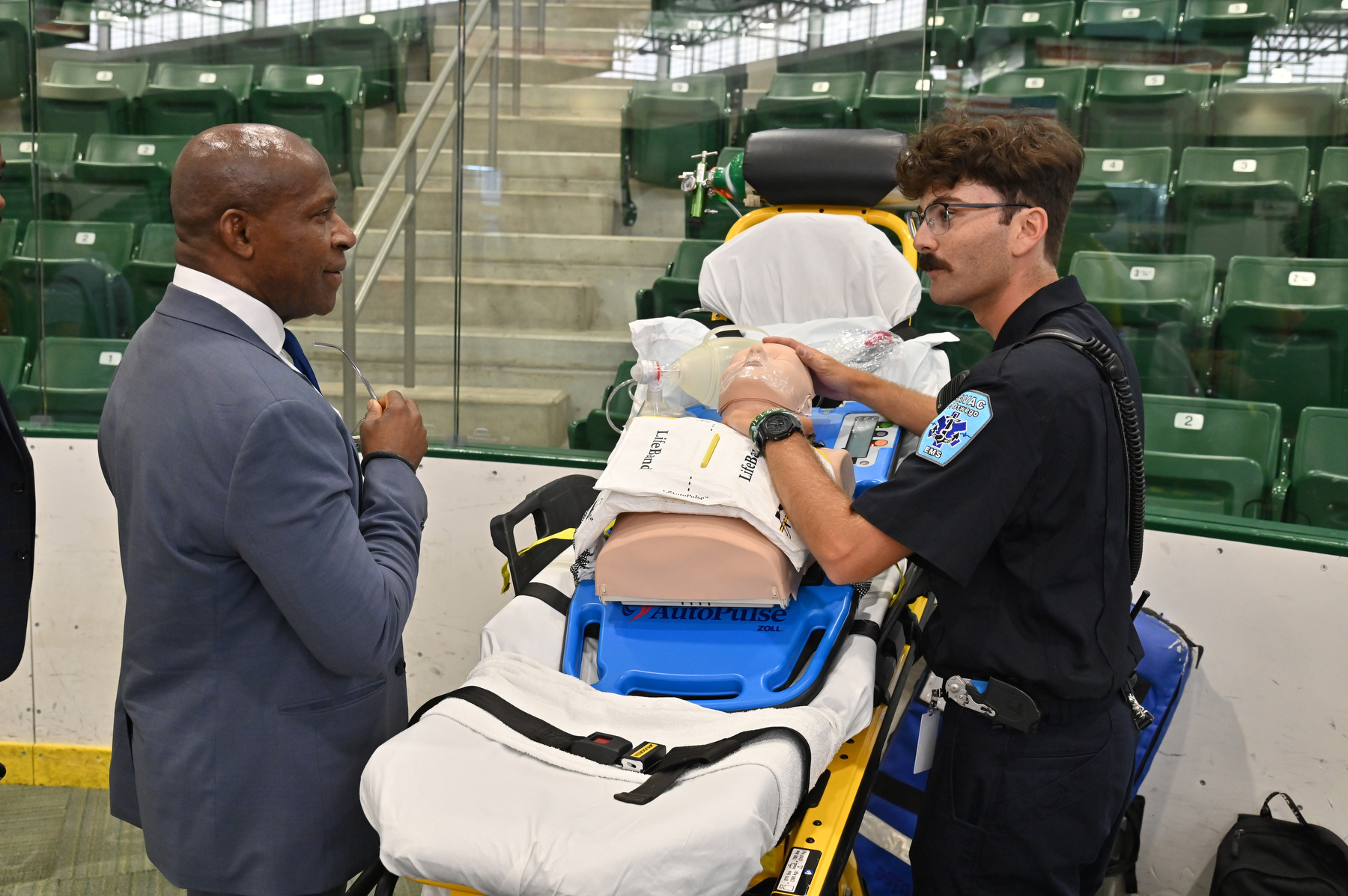 At the fall Student Involvement Fair, President Peter O. Nwosu talks with Harrison Feldman, a junior technology education major, and an emergency medical technician with the Student Association Volunteer Ambulance Corps.