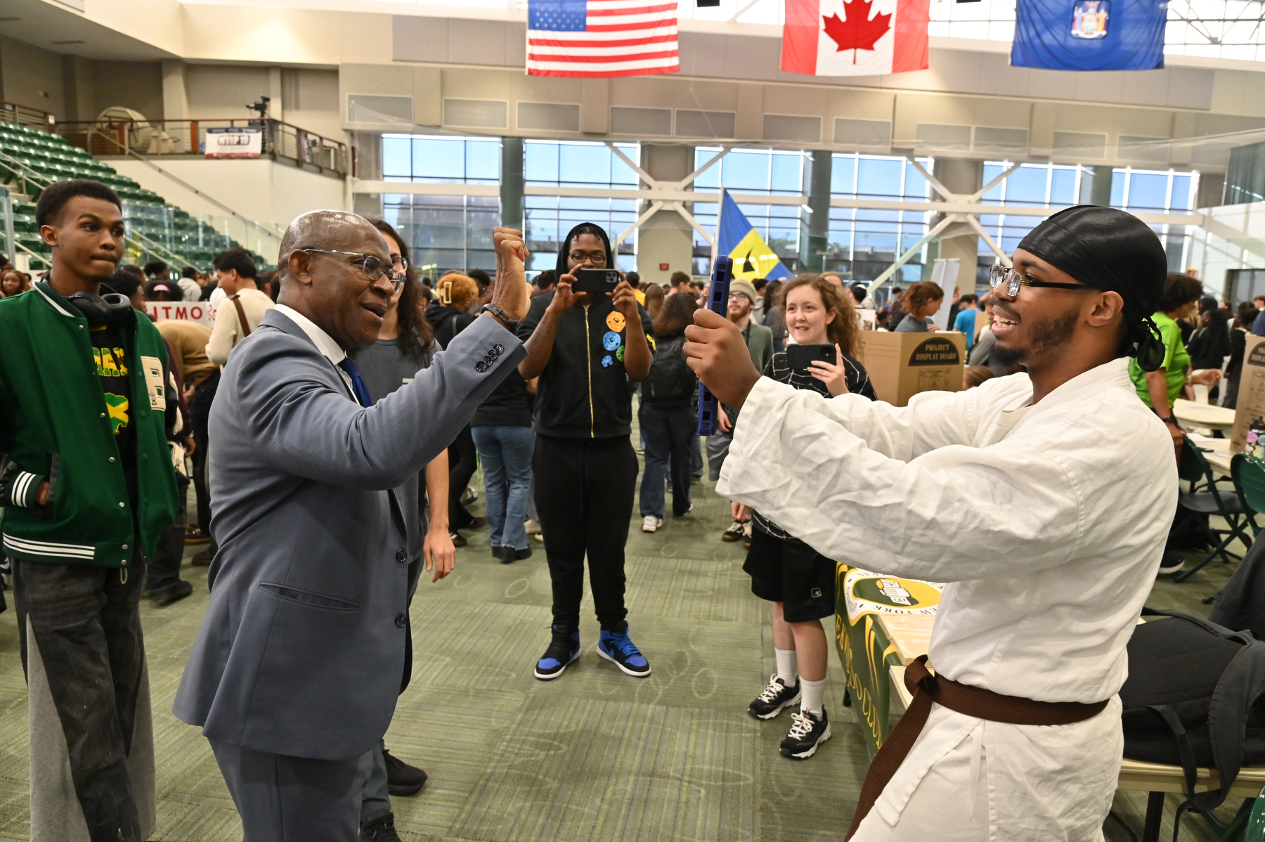 The popular Student Involvement Fair on Aug. 27 in the Deborah F. Stanley Arena and Convocation Hall provides the chance to meet hundreds of campus clubs and student organizations. President Peter O. Nwosu (pictured) enjoyed a moment practicing a martial arts lesson with members of the Karate Club while visiting.