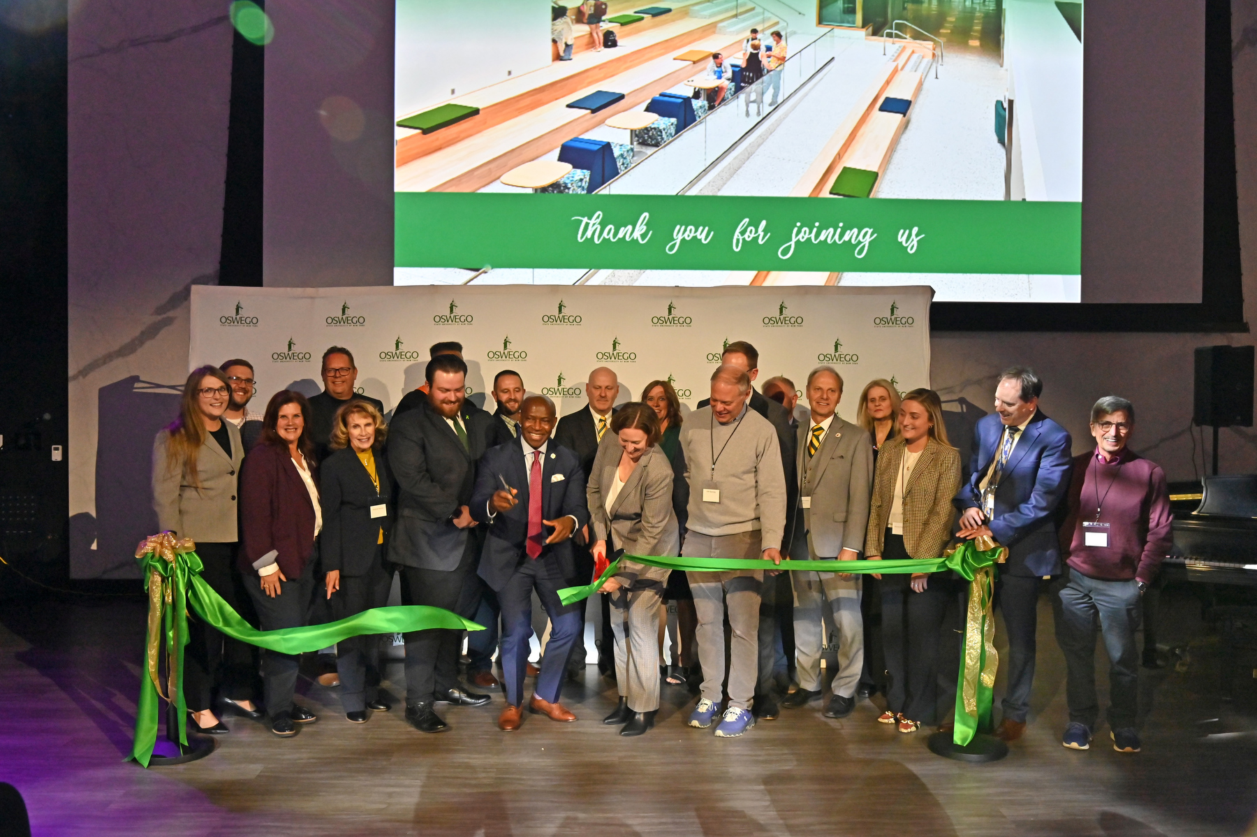 President Peter O. Nwosu and Jennifer Knapp, dean of the College of Communication, Media and the Arts, surrounded by members of the Laker family, partners and supporters, cut the ceremonial ribbon officially re-opening Hewitt Hall during a reception held Oct. 24.