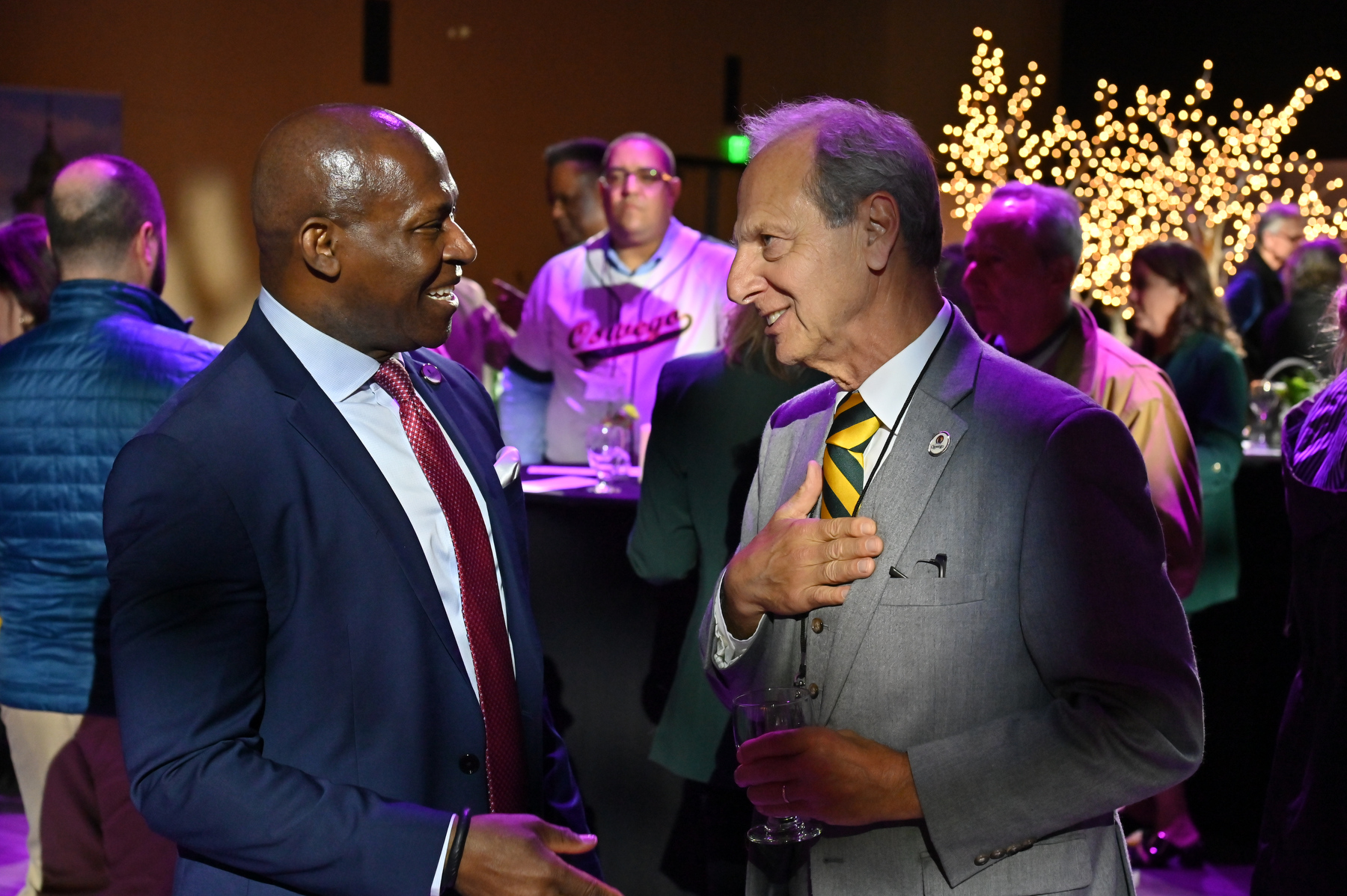 President Peter O. Nwosu talks with Oswego Mayor Robert Corradino at the Hewitt Hall re-opening ceremonies held Oct. 24.