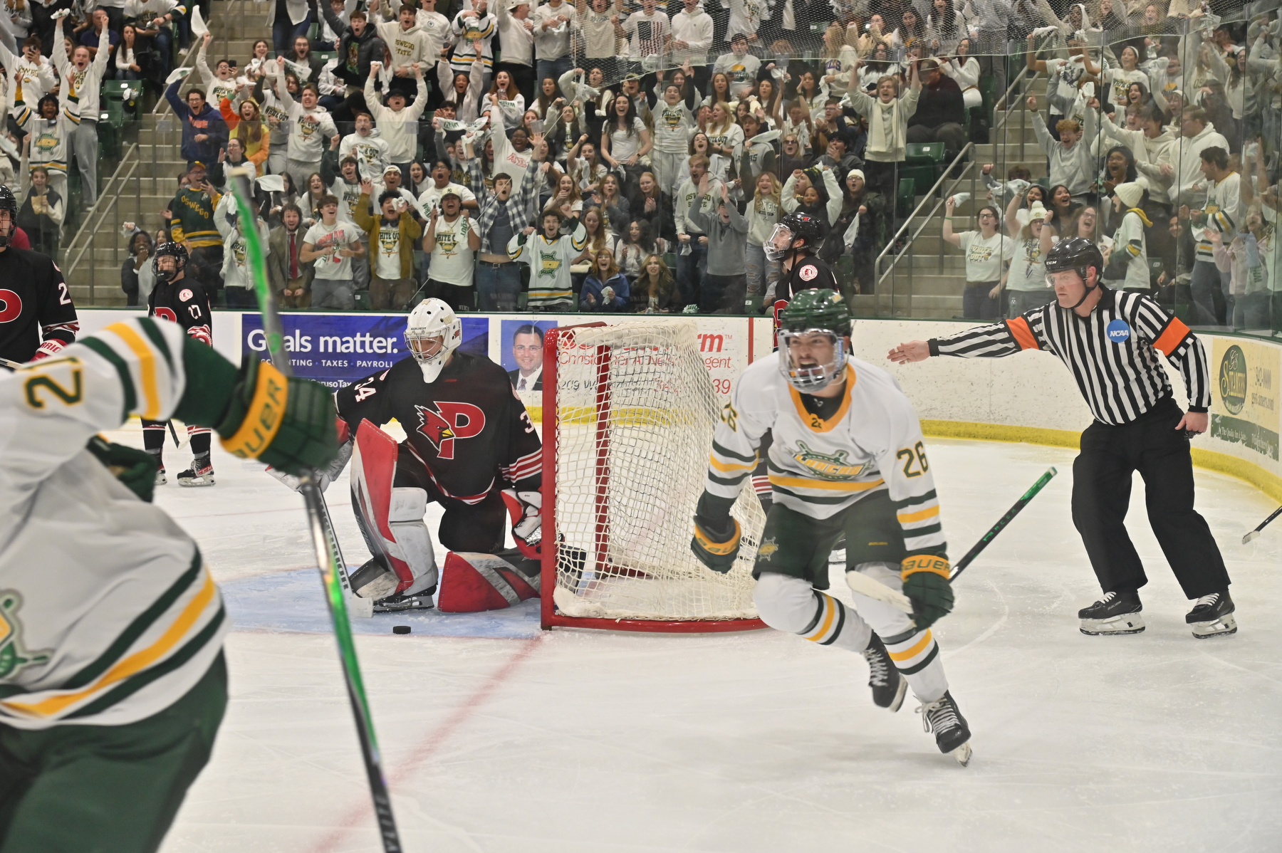 In front of a roaring White Out crowd at the Deborah F. Stanley Arena and Convocation Hall on Nov. 14, Oswego State delivered one of the most dramatic finishes the rivalry has ever seen — scoring with one second left to stun Plattsburgh, 3–2, and keep the White Out magic alive. Jesse Horacek (#26) a sophomore, celebrates after he made Oswego's first goal of the game.