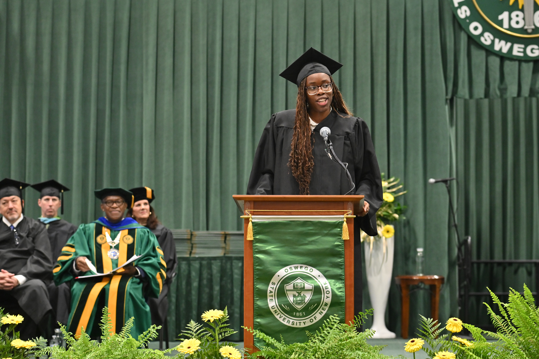 Oghenetega (Tega) Adjoh, Student Association president, gives the student address at December Commencement.