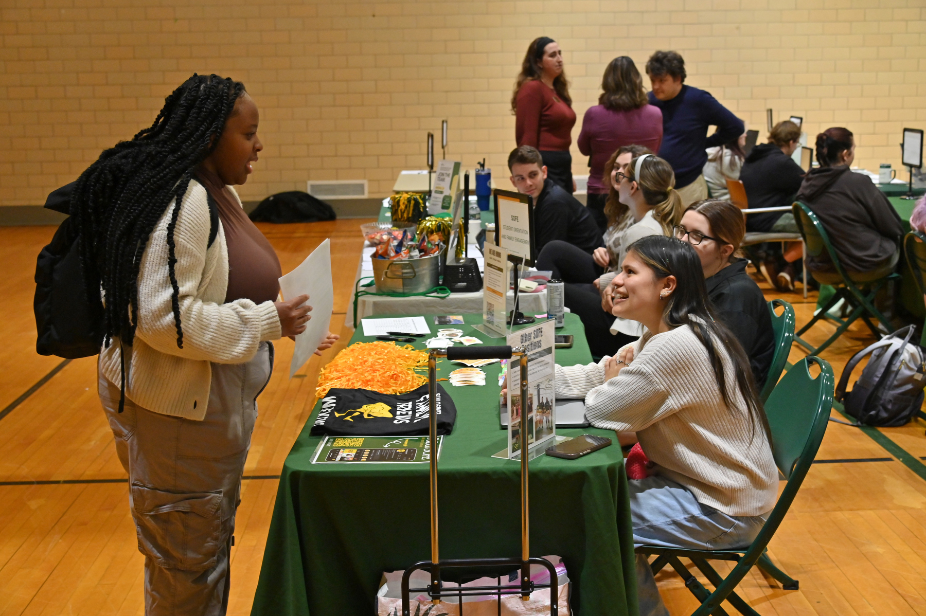 A Campus Opportunities Expo hosted by the Office of Experiential Learning took place in March in Swetman Gym, featuring dozens of campus offices and resources available for students. Here the Student Orientation and Family Engagement Office provides information about their many programs and opportunities.