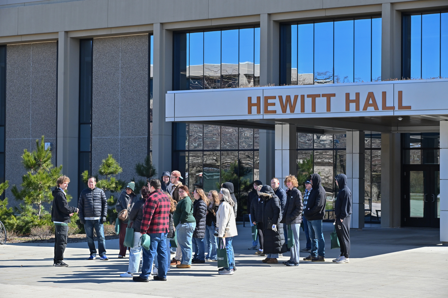 Spring Admitted Student Days are designed for students who have already been admitted to SUNY Oswego to provide them with the opportunity to tour the campus; meet with faculty, staff and students; learn about the many academic possibilities offered; and attend presentations on financial aid, housing and more. Pictured, Admissions intern Dexter Armstrong leads a tour through Hewitt Hall on March 27.
