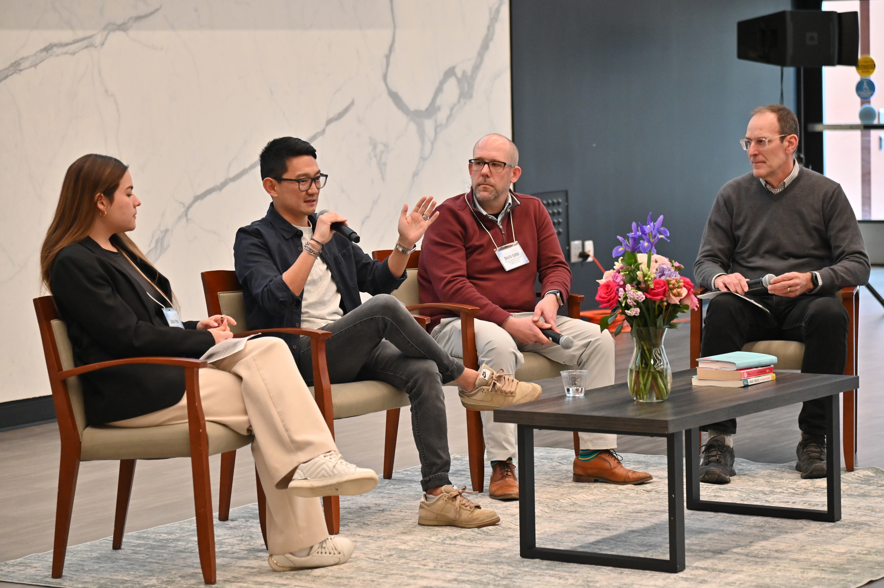 A panel of industry leaders discussed how AI is shifting the job market and which human skills employers are prioritizing in 2026. Presenting before a Hewitt Hall Ballroom audience in April are, from left: Diana Pena, senior economist with the New York State Department of Labor; 2007 graduate Jeff Knauss CEO of Arcovo AI; Dave Kahn, interim assistant director of client support for SUNY Oswego’s Campus Technology Services; and moderator Jim Early of Oswego’s computer science faculty.