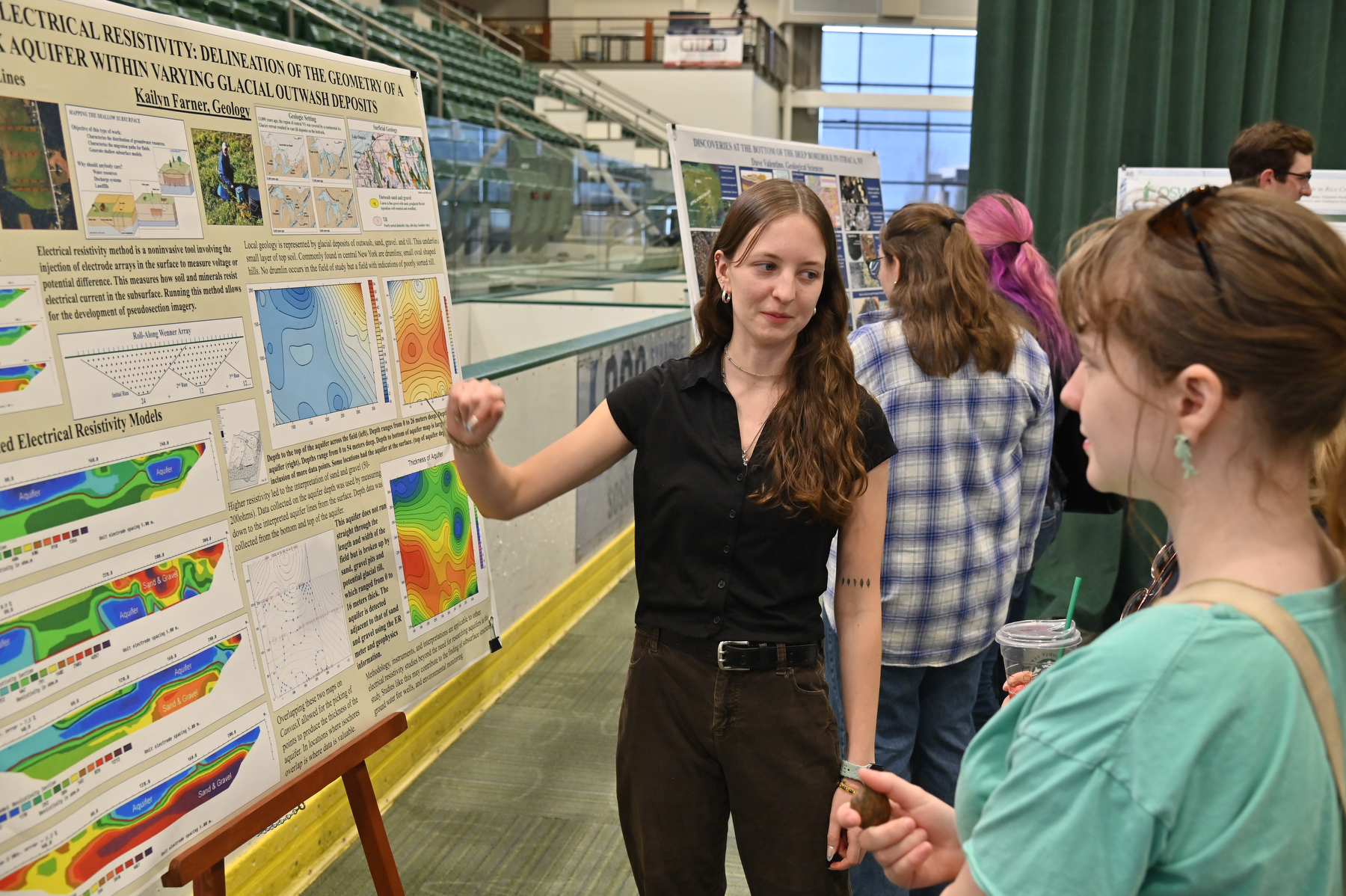 SUNY Oswego’s Quest, held April 22 this year, is an annual symposium dedicated to sharing the scholarly and creative pursuits of students, faculty and staff of SUNY at Oswego. Kailyn Farner, pictured, talks with fellow students during the poster session about her atmospheric and geological sciences research on "3D electrical resistivity exploration of groundwater in glacial outwash, New Haven, NY."