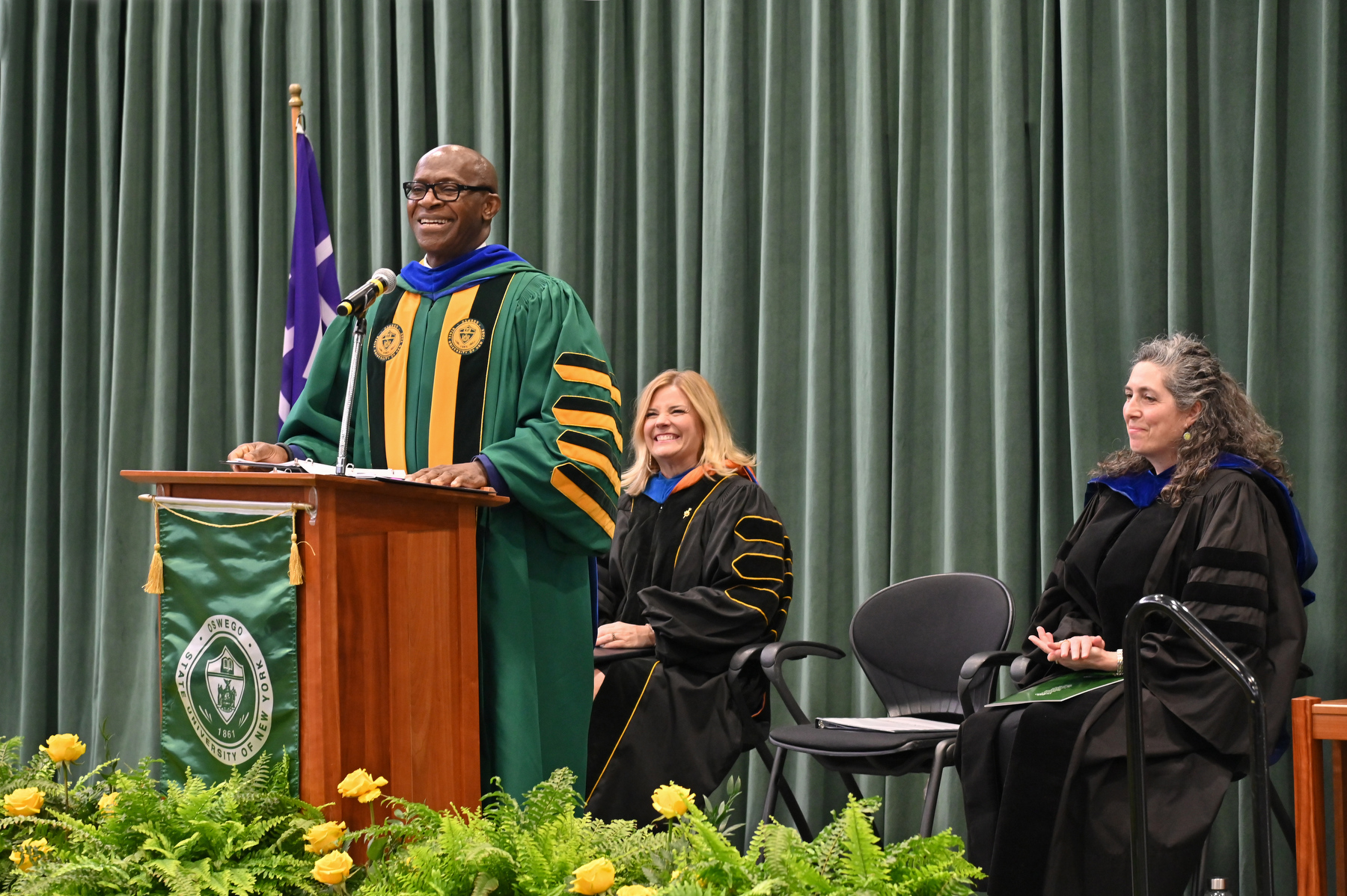 President Peter O. Nwosu speaks during the annual Honors Convocation held April 24 in the Deborah F. Stanley Arena and Convocation Hall. Honors Convocation continues as a tradition to recognize Oswego student award winners and those who have demonstrated excellence in their field of study or in service to the college community.