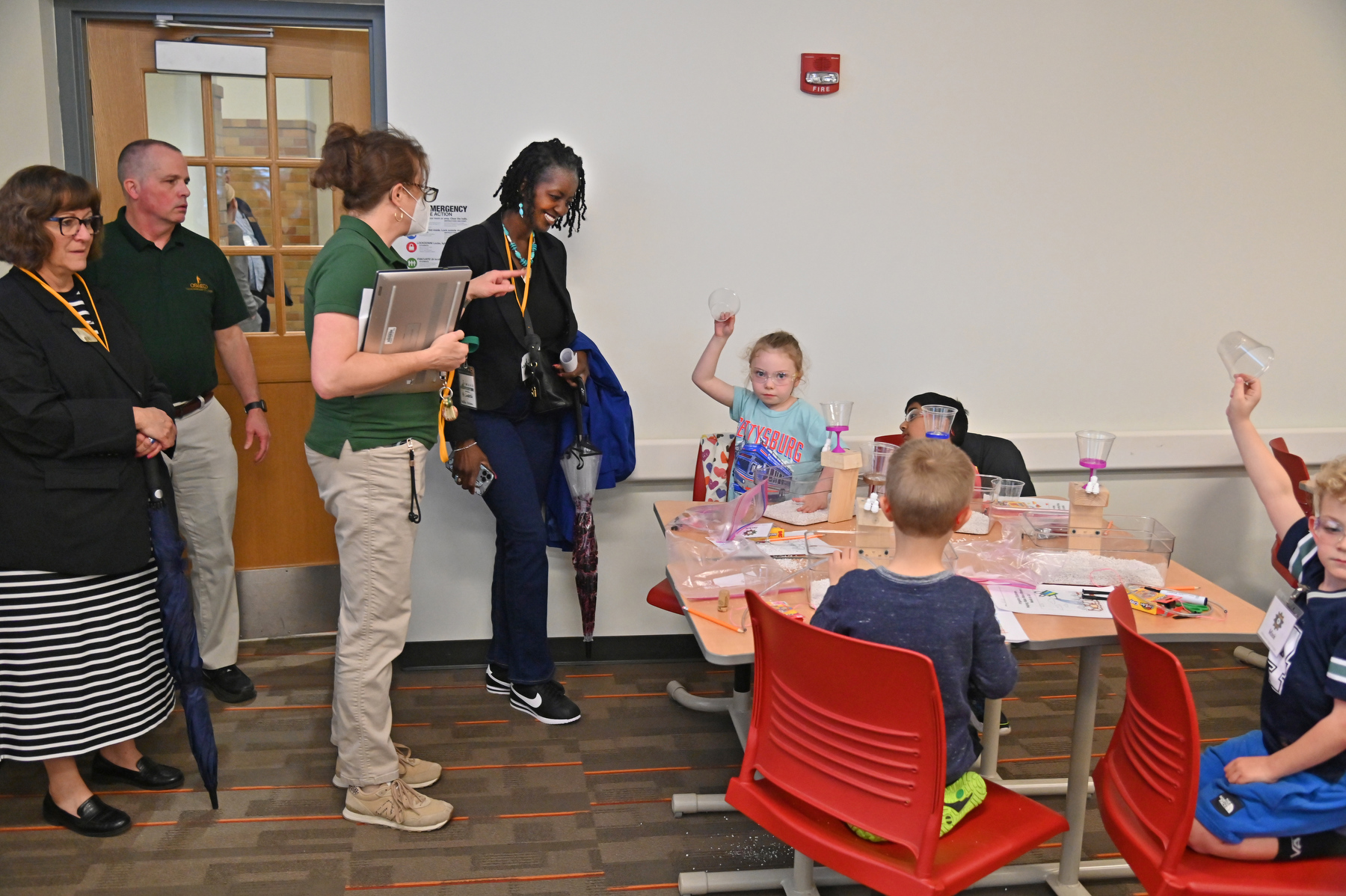 Gwendolyn Sanders (center), senior community relations manager with National Grid, and Susan Cole (not pictured) of National Grid visited classrooms April 29 in Park Hall for the final KidsTech session of the 2026 spring semester. The Technology Department and its students host the hands-on sessions, thanks to generous National Grid funding.