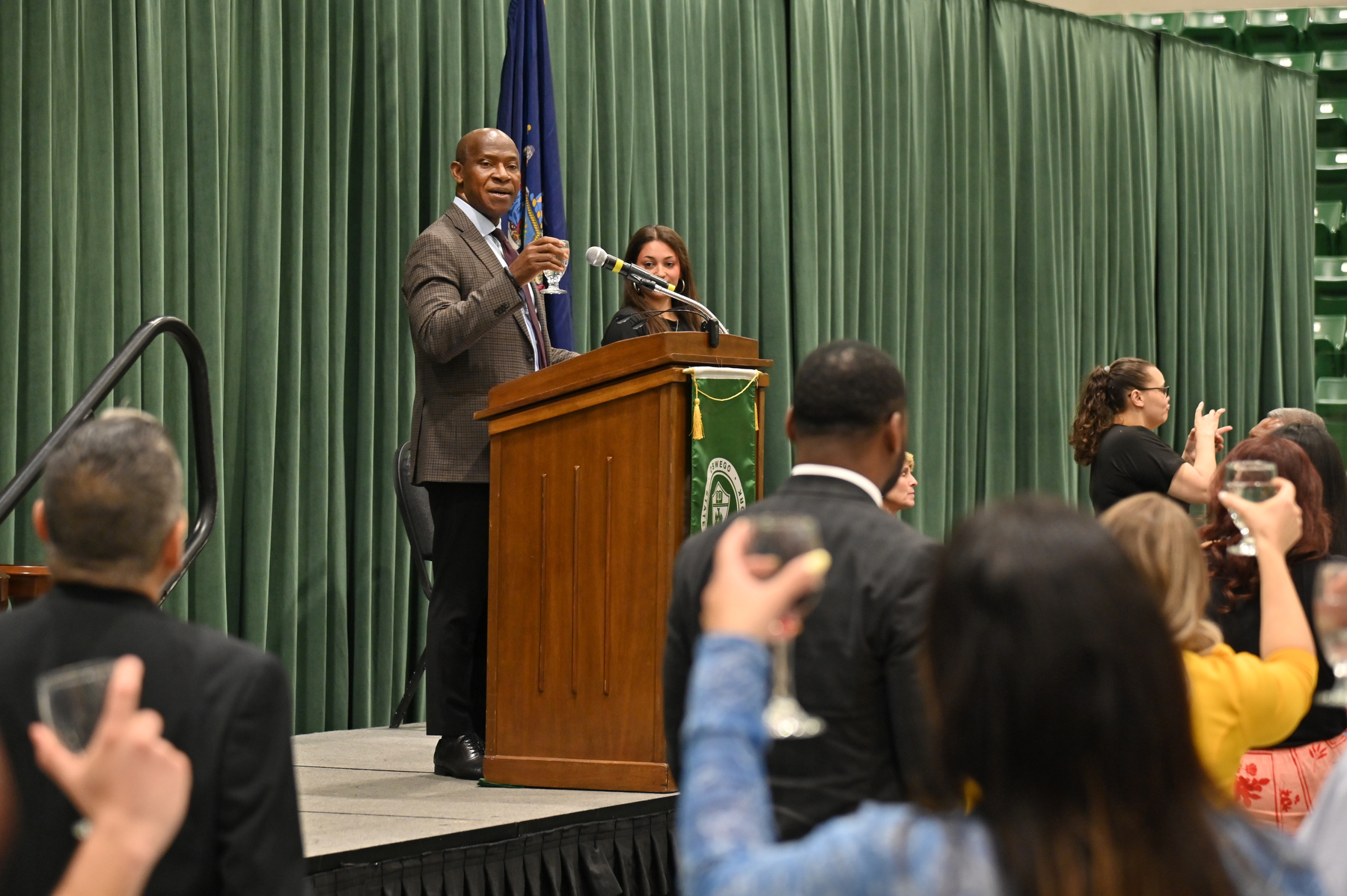 President Peter O. Nwosu toasts the Class of 2026 during the Commencement Eve Celebratory Reception for the graduating seniors and their families held May 15 in the Deborah F. Stanley Arena and Convocation Hall.