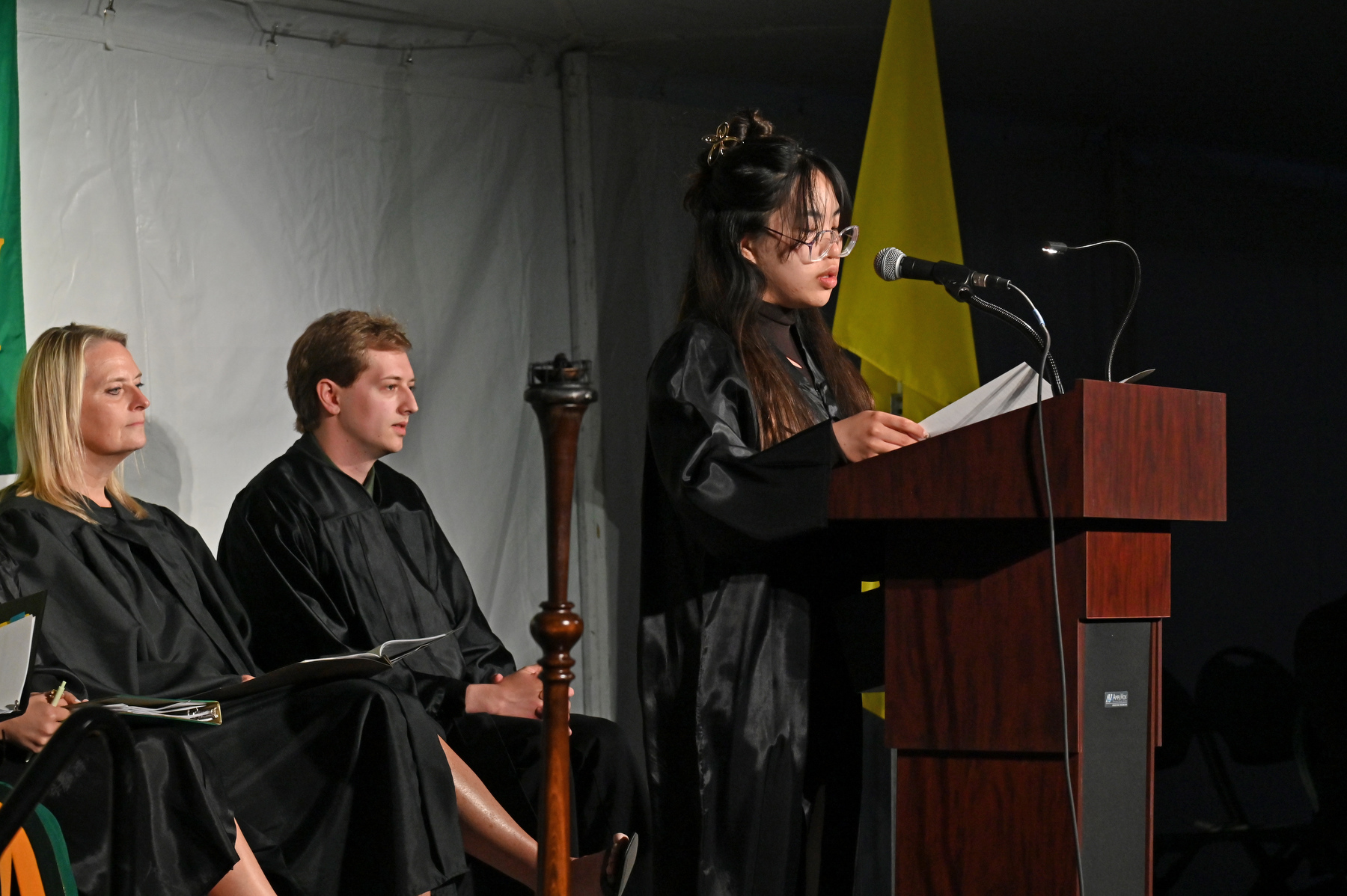 Emma Halsey served as student emcee on the platform during the Commencement Eve Torchlight Ceremony.