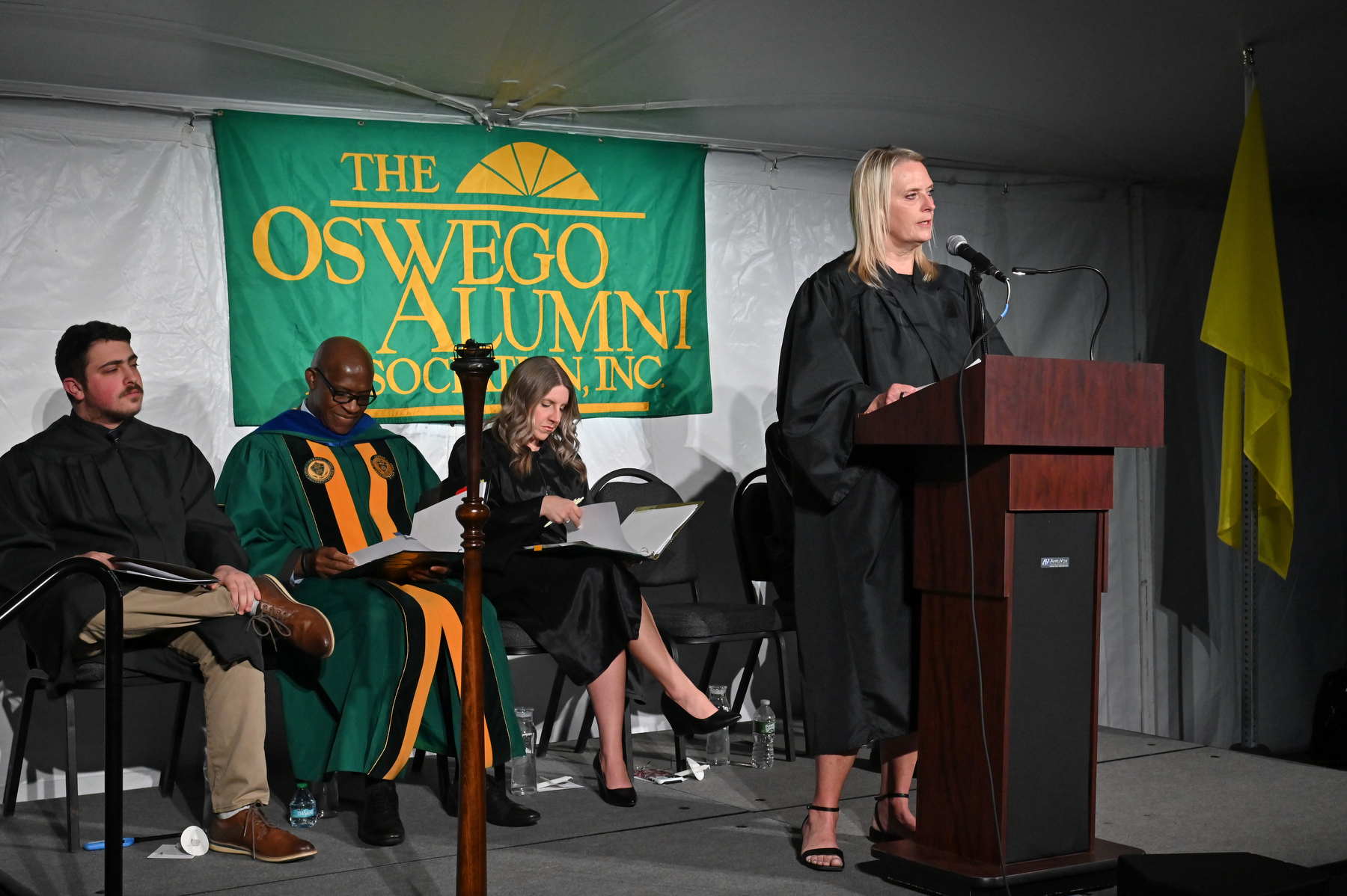 Katie Kranze Million, a 1991 Oswego graduate and manager of the 2026 Olympic gold-winning women’s ice hockey team, provided the alumni remarks during the Commencement Eve Torchlight Ceremony