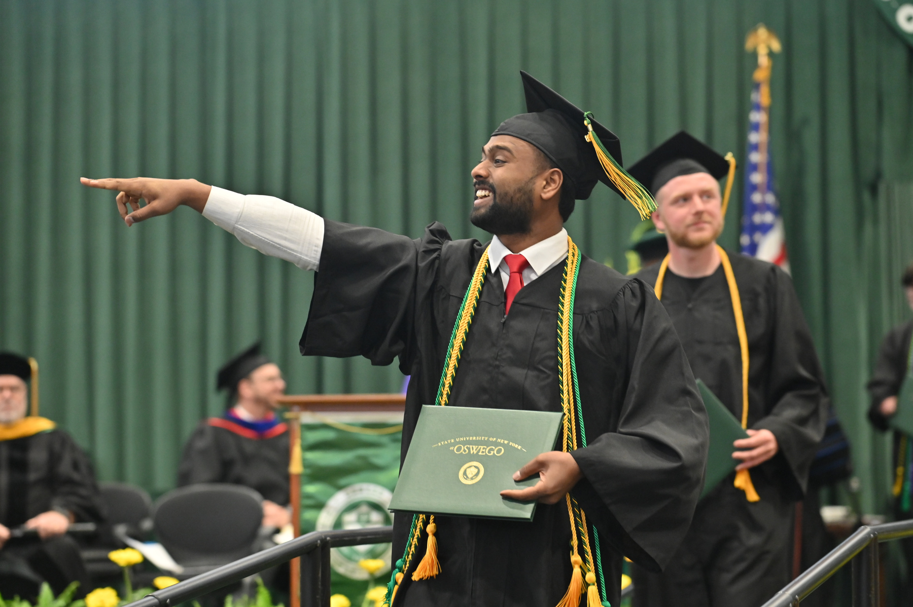 Physics major Shaheen Chowdhury shares a moment with supporters after walking the stage at the 9 a.m. ceremony for the College of Liberal Arts, Sciences and Engineering.