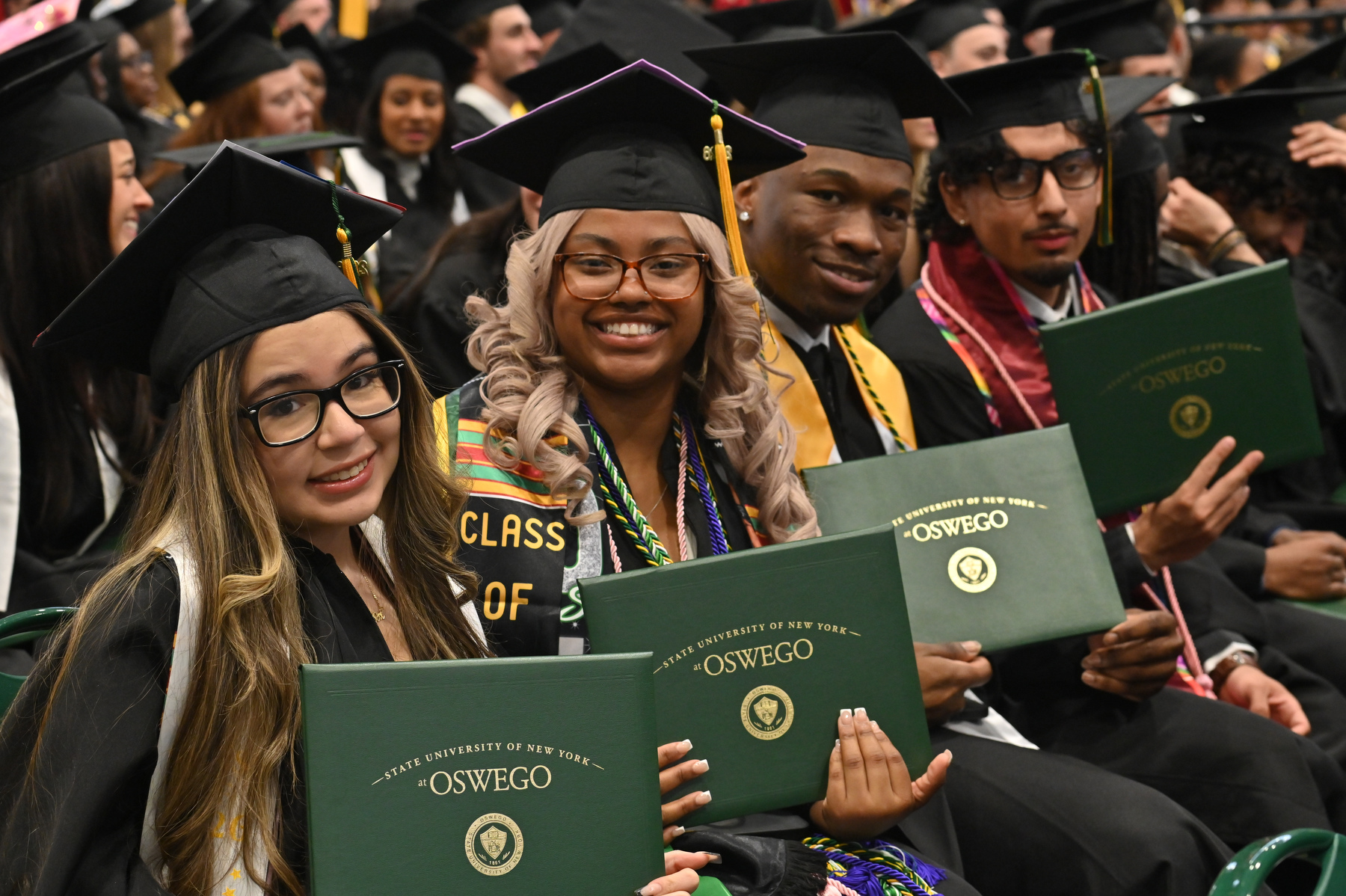 Smiles abound during a day worthy of celebration like Oswego's May 16 commencement.