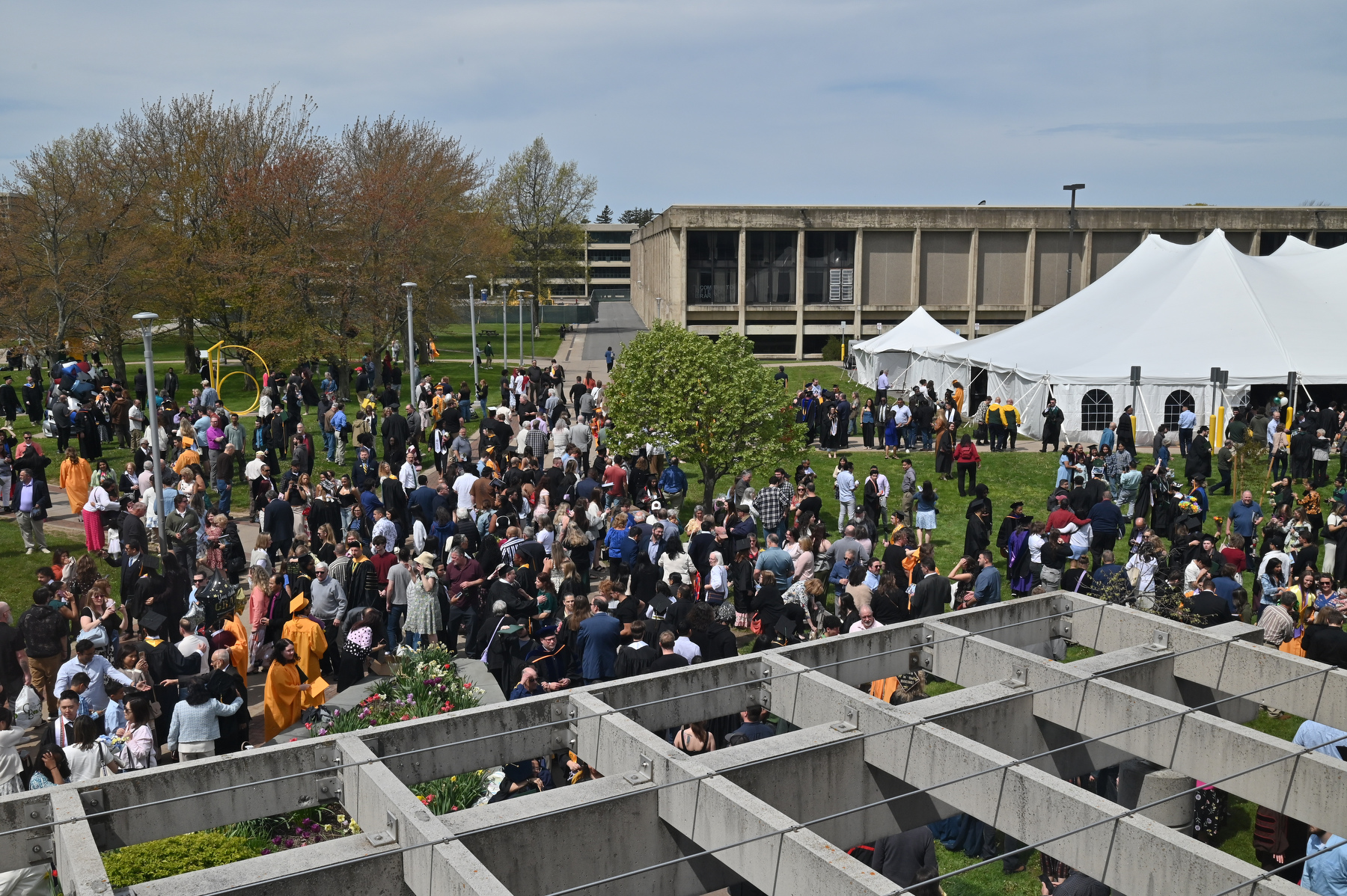 Graduates and their families and supporters gather in the reception area outside Marano Campus Center following the 9 a.m. ceremony for the College of Liberal Arts, Sciences and Engineering.