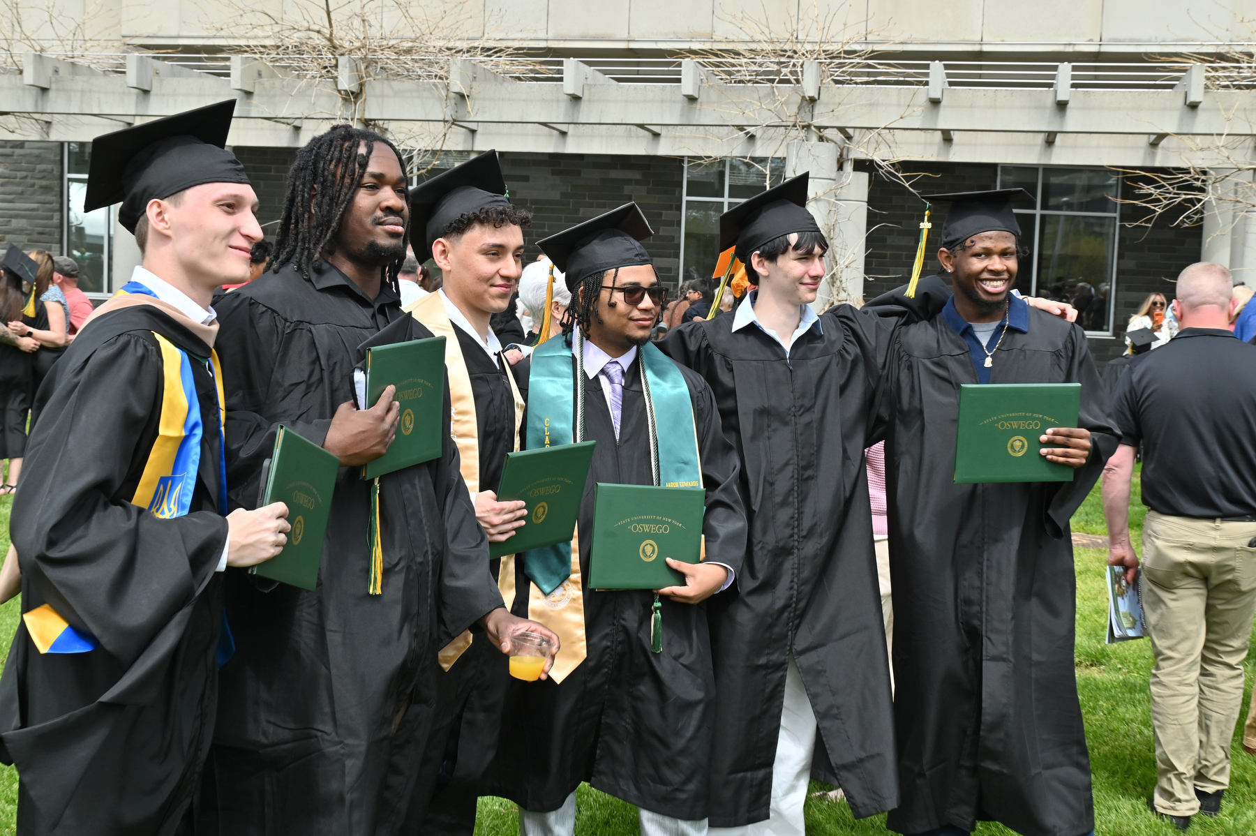 May commencement allowed an opportunity for Lakers to bask in their achievements and some spring sun, including these classmates after the 12:30 p.m. ceremony for the College of Business and Entrepreneurship.