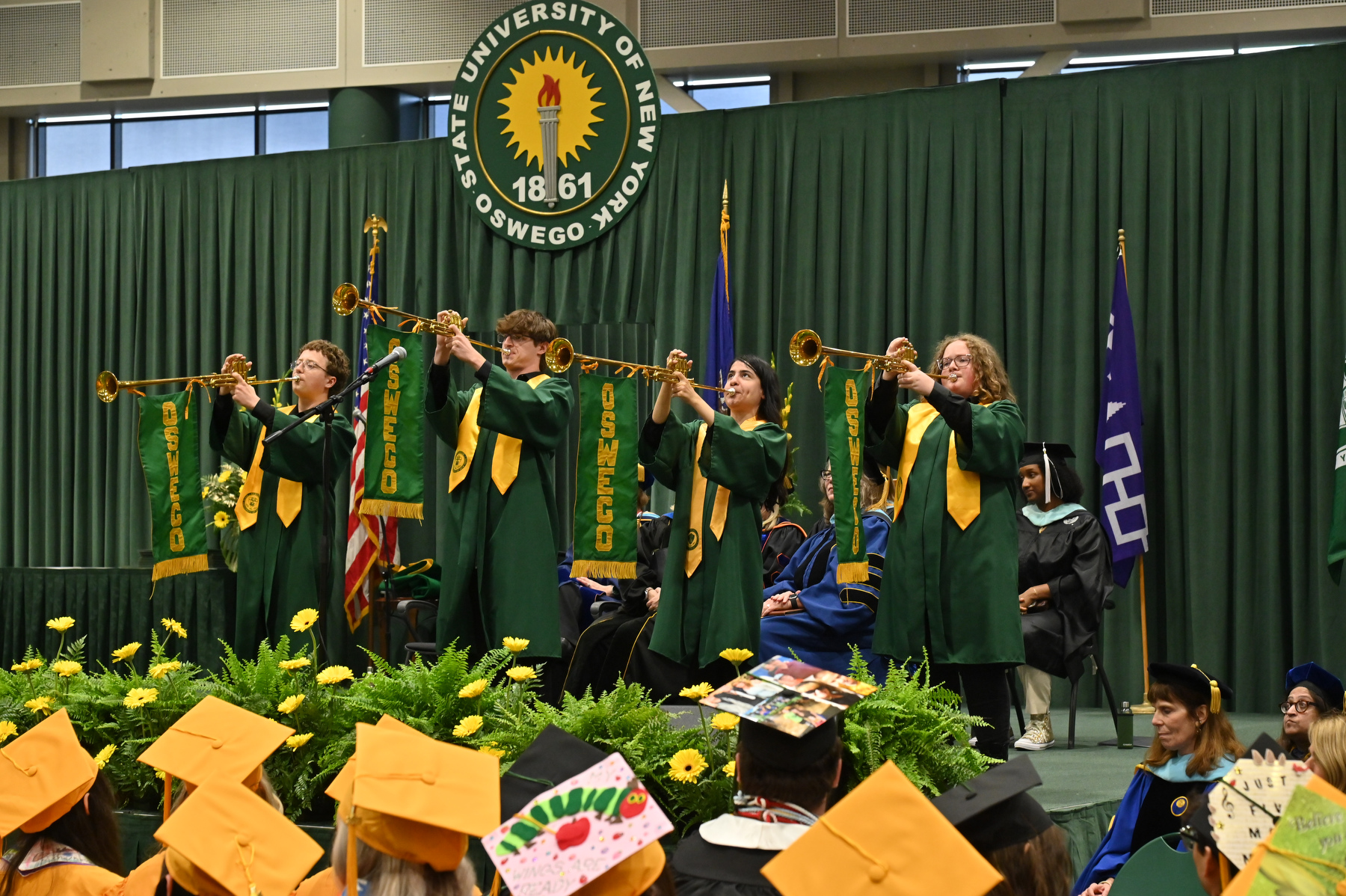 Student trumpeters serve as the bookends for commencement ceremonies, heralding its opening and acknowledging its conclusion.