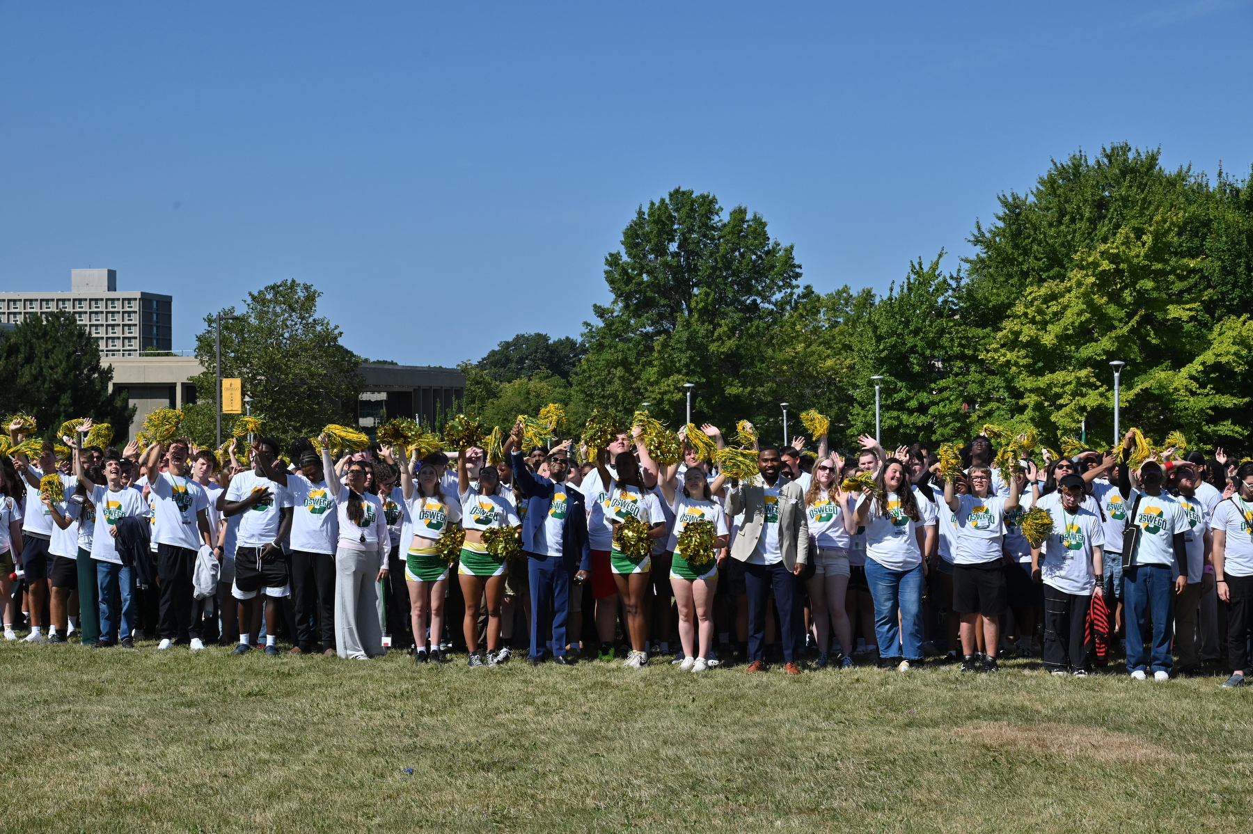 Incoming students gather with special guests President Peter O. Nwosu (center) and Jamal Coleman, director of operations in the Office of the President, Aug. 21 on the lawn outside Marano Campus Center to celebrate the "O"pening of the fall semester.