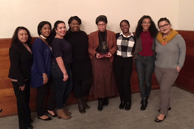 Organizations that host the African, Latino, Asian and Native American Student Leadership Conference make presentation to Catherine Santos