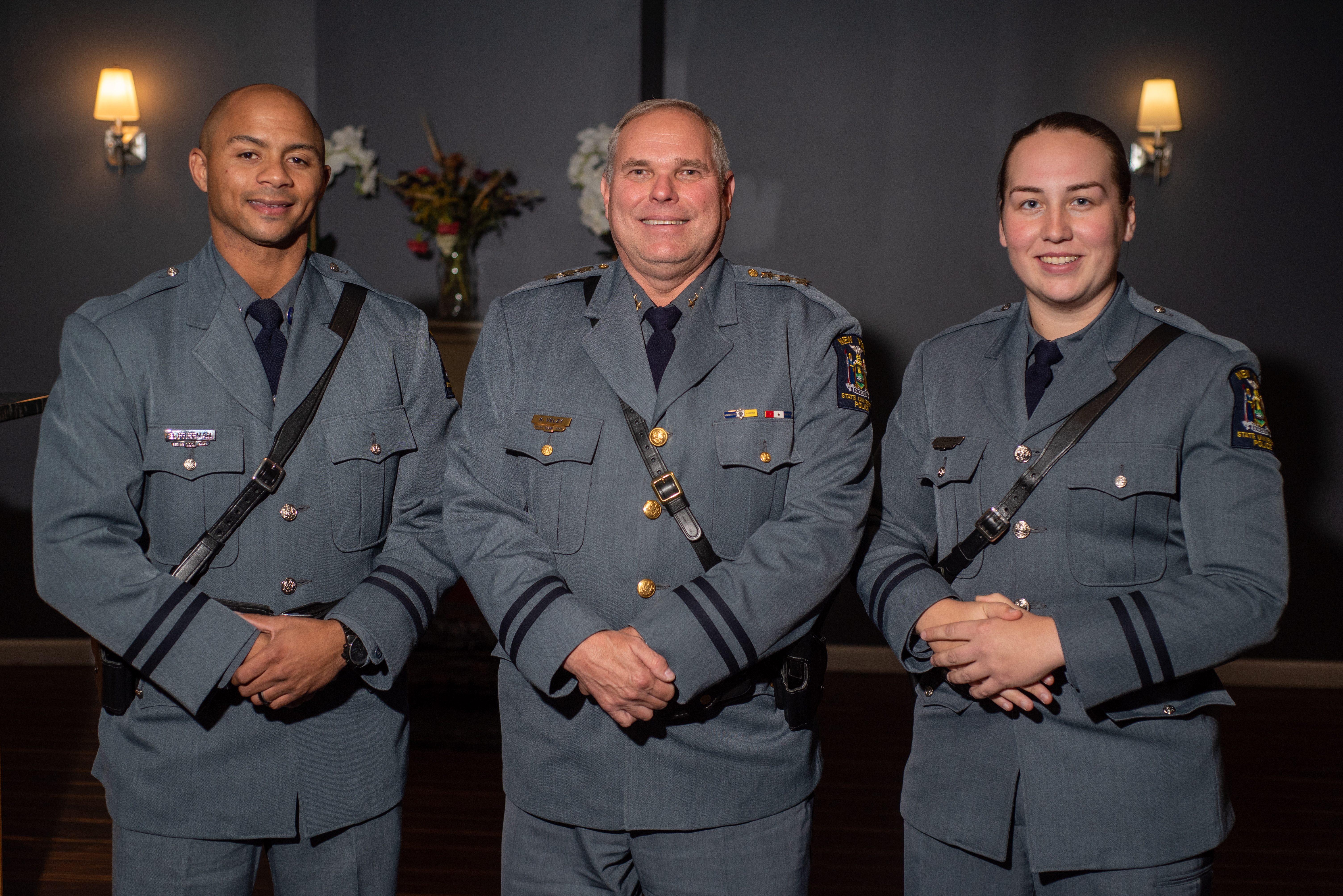 University Police Chief Kevin Velzy (center) offers his congratulations to Officer Benjamin Freeman (left) and Officer Christina Bedard, who graduated from the Alfred State Police Academy on Friday, Oct. 22.