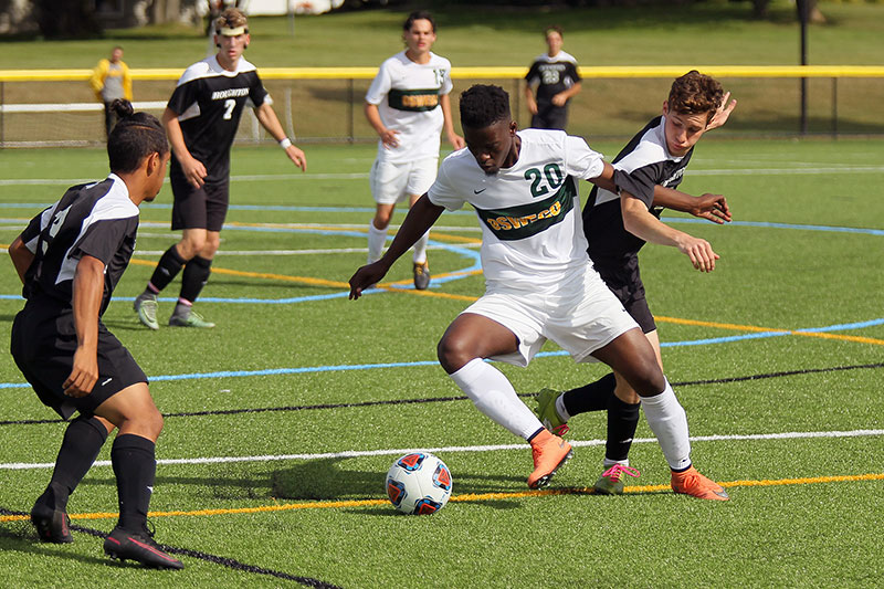 Soccer player Hassan Musa dribbling