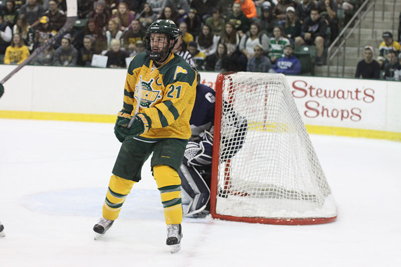 Kenny Neil in front of hockey goal