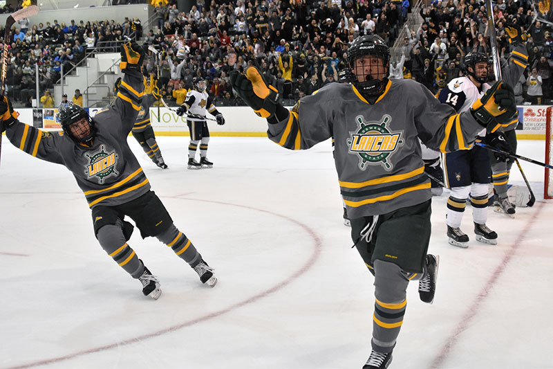 Laker men's hockey players celebrate goal