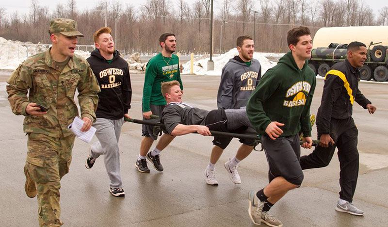 Baseball team training with Fort Drum soldiers